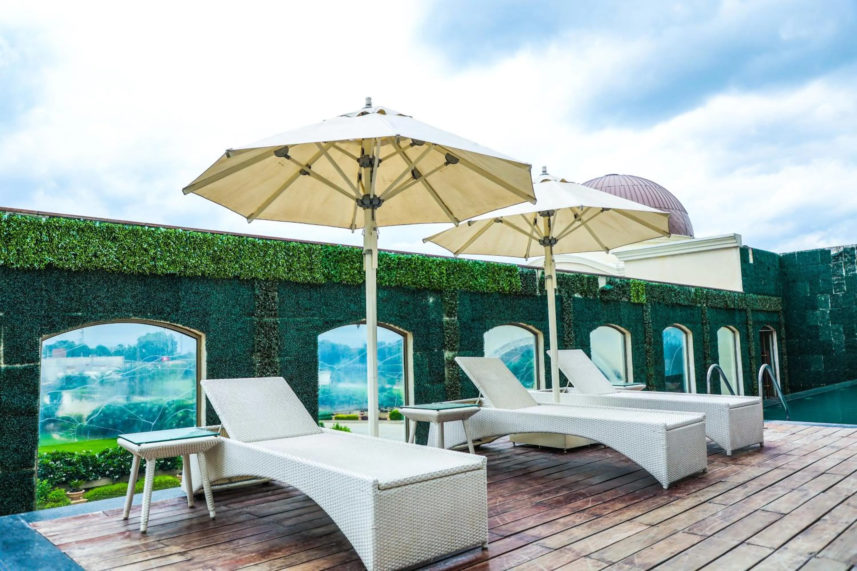 Swimming pool in Ramada Plaza by Wyndham Lucknow