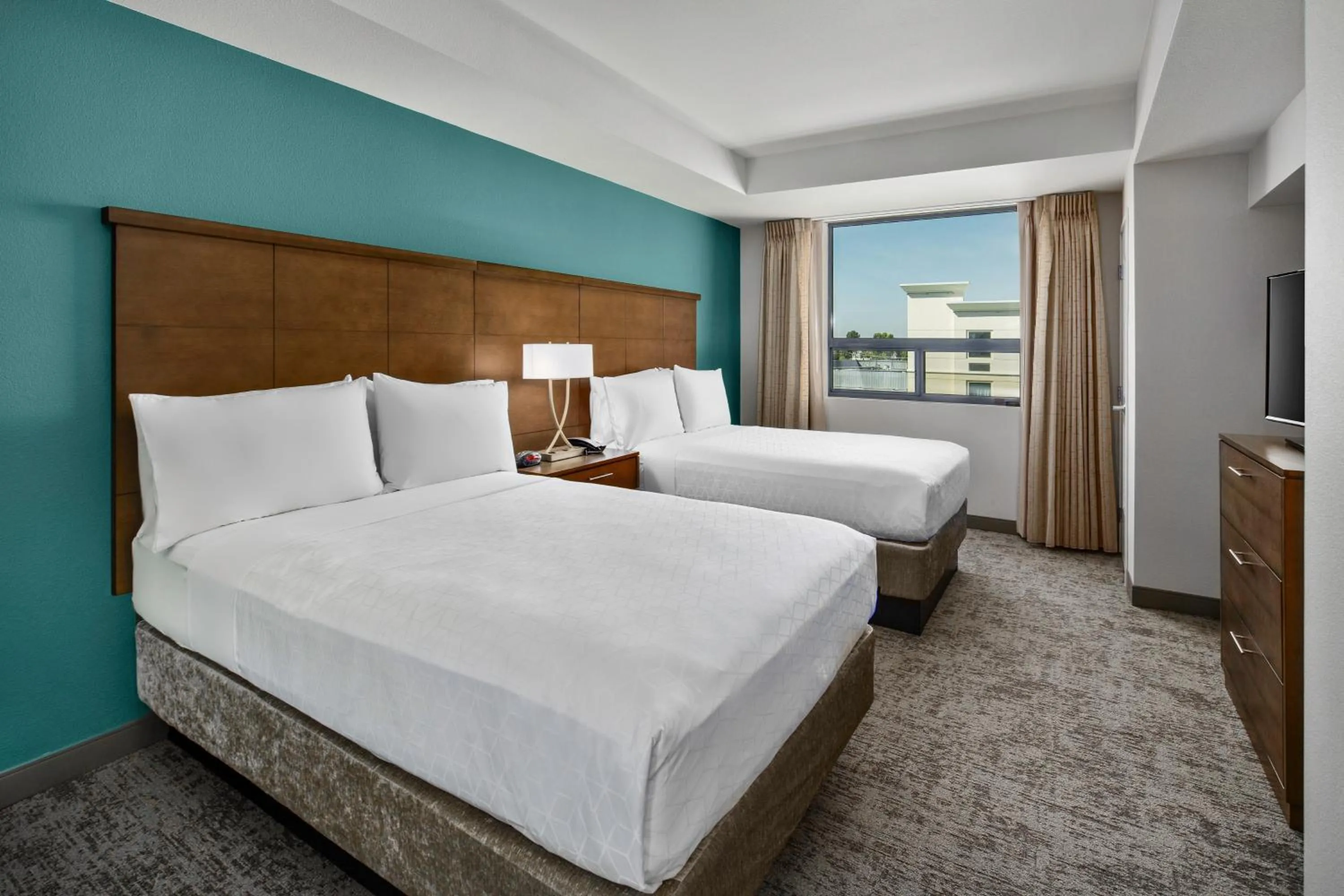 Photo of the whole room, Bed in Staybridge Suites Irvine - John Wayne Airport by IHG