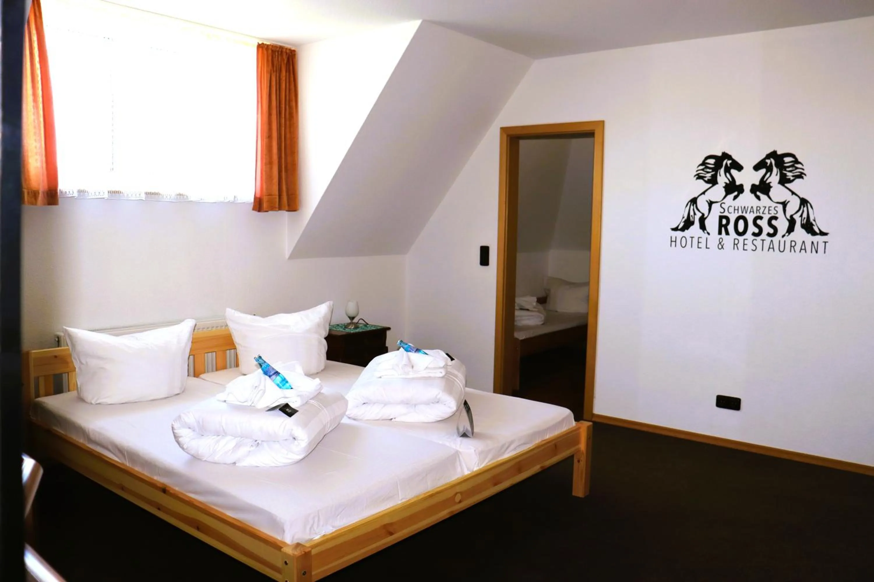 Photo of the whole room, Bed in Schwarzes Ross Hotel & Restaurant Oberwiesenthal