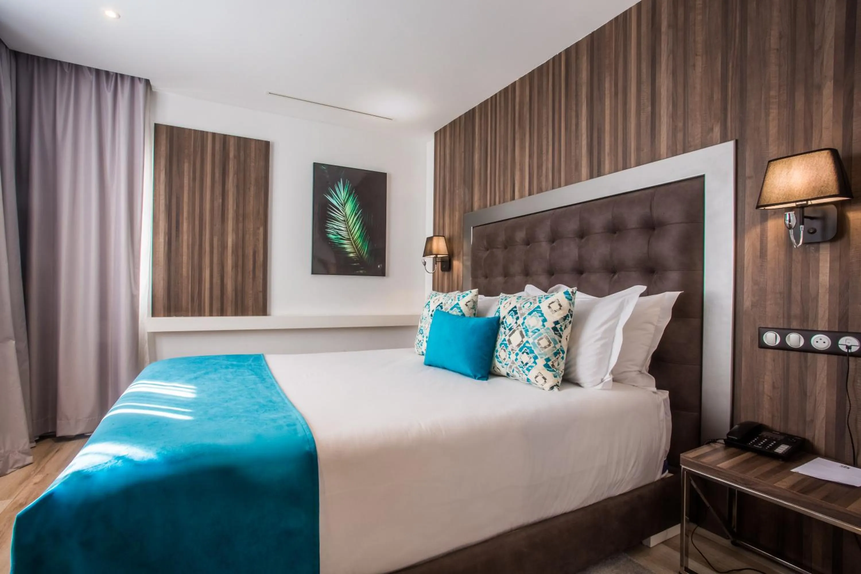 Bed in SBN Suite Hôtel