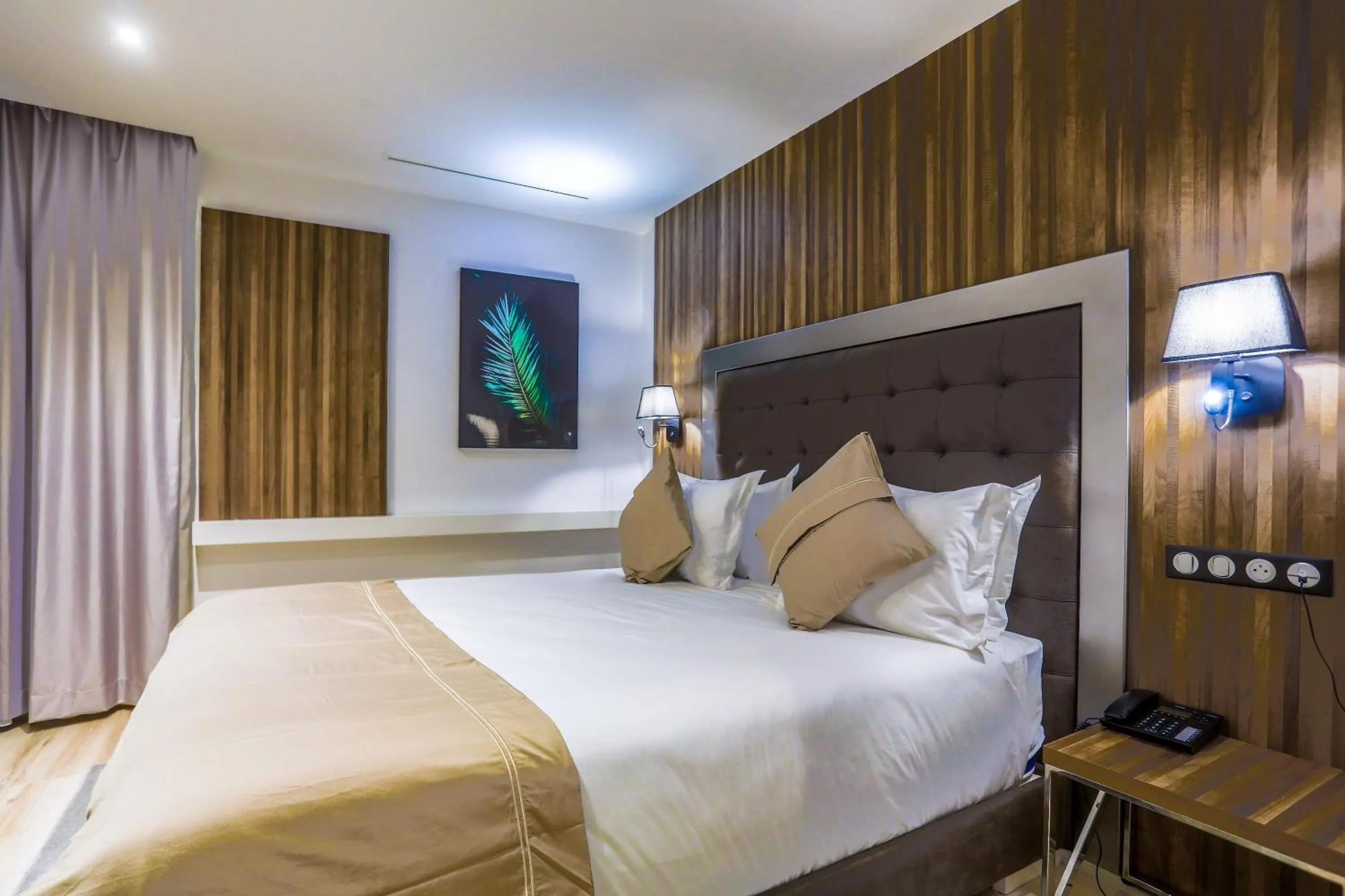 Bed in SBN Suite Hôtel