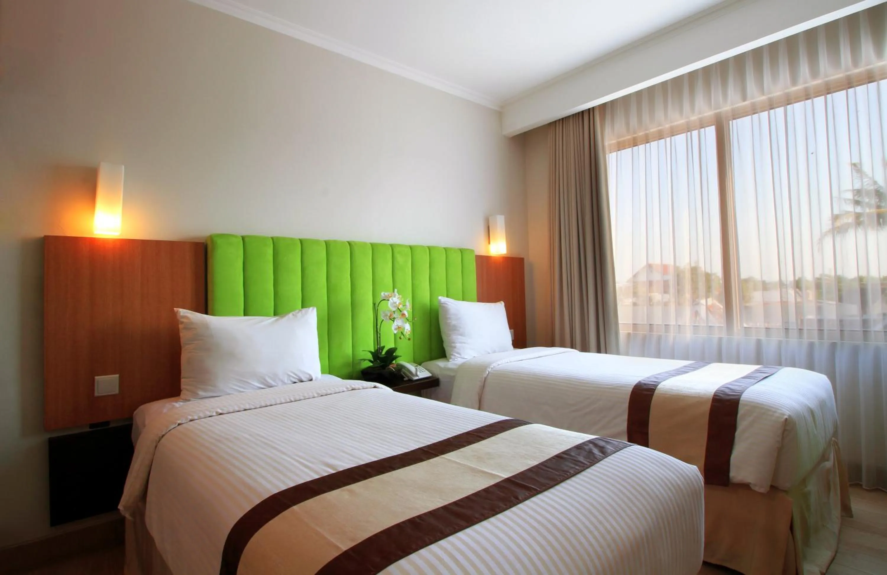 Bed in Bueno Colombo Hotel Yogyakarta