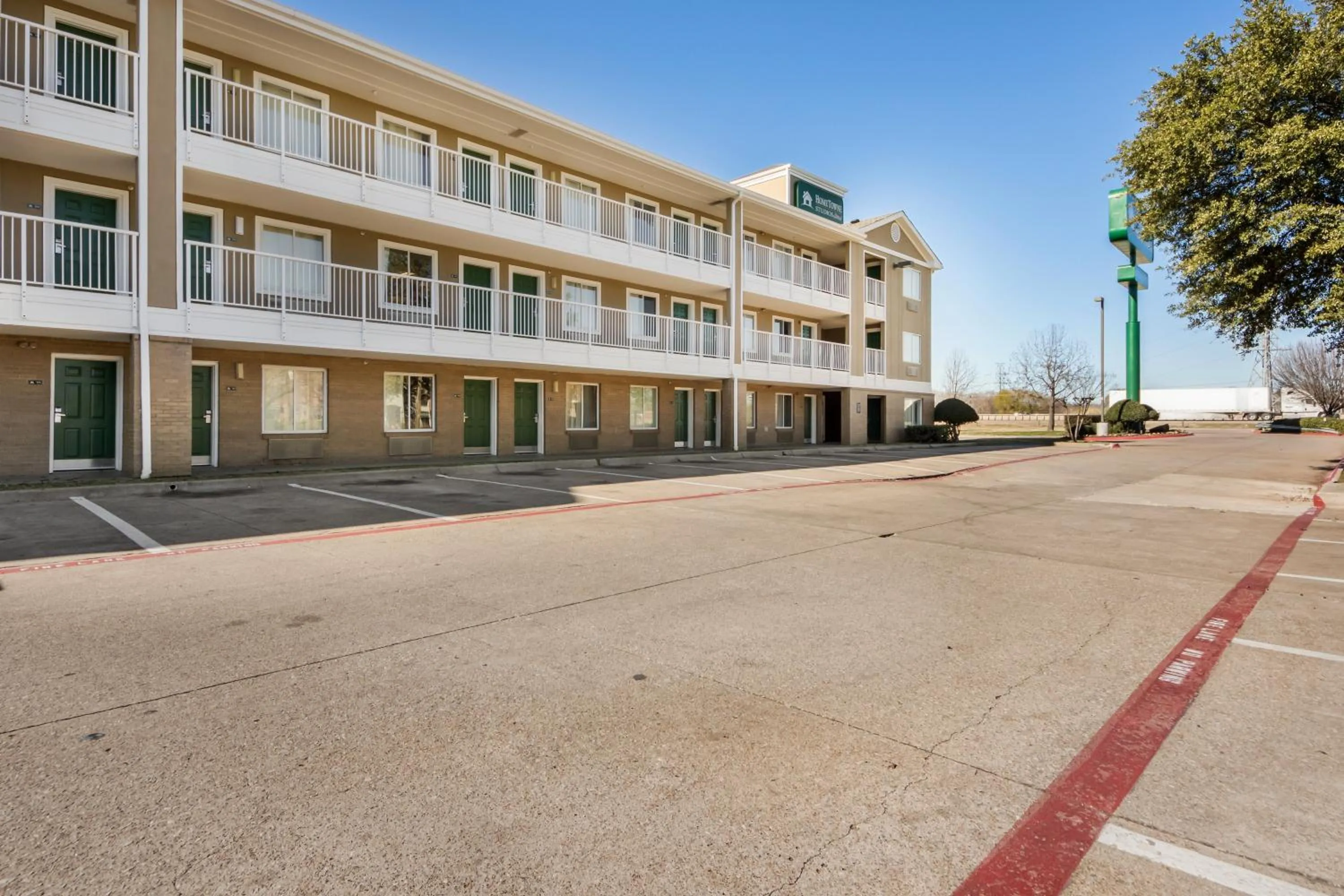 Property building in HomeTowne Studios by Red Roof Dallas - Mesquite