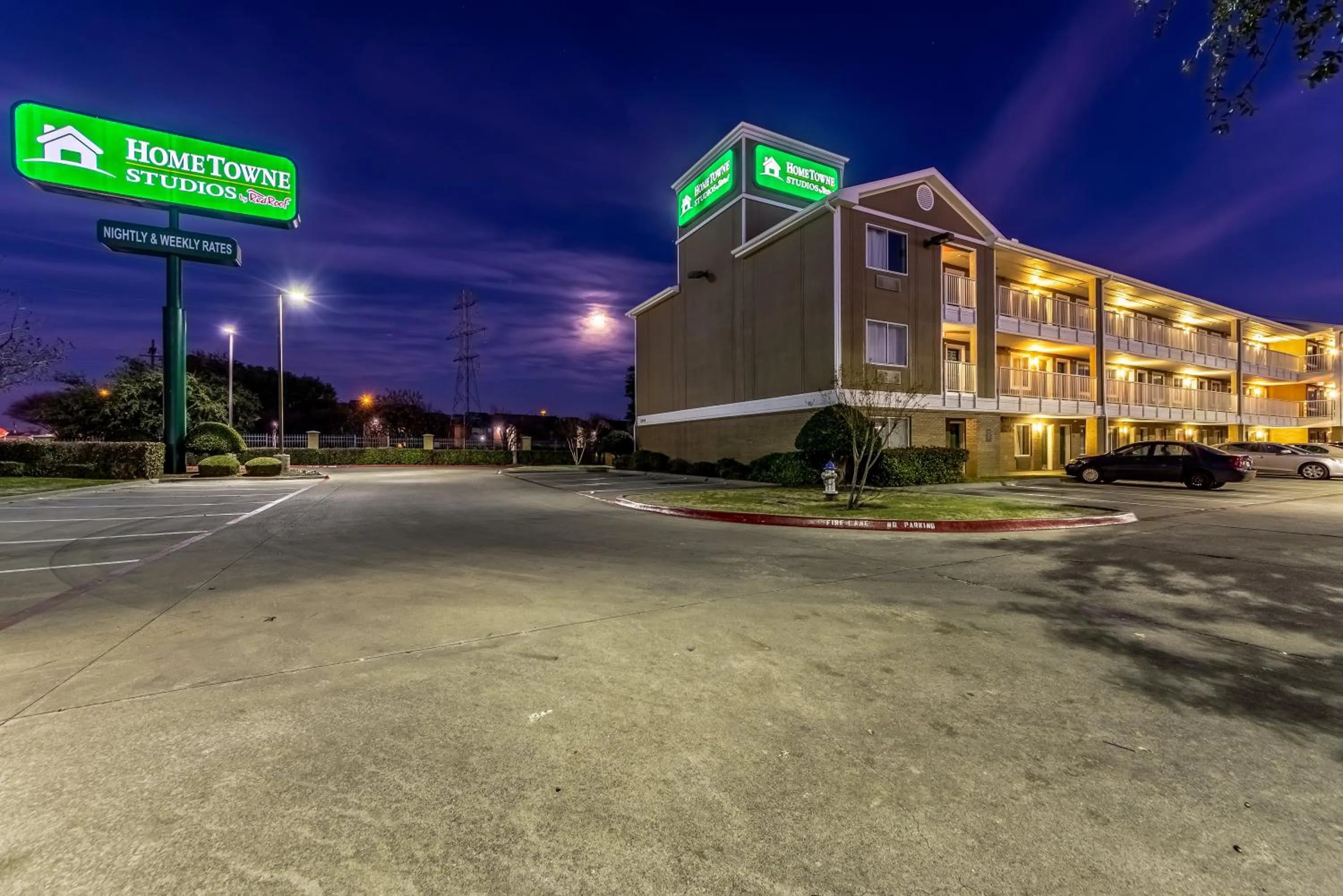 Property building in HomeTowne Studios by Red Roof Dallas - Mesquite