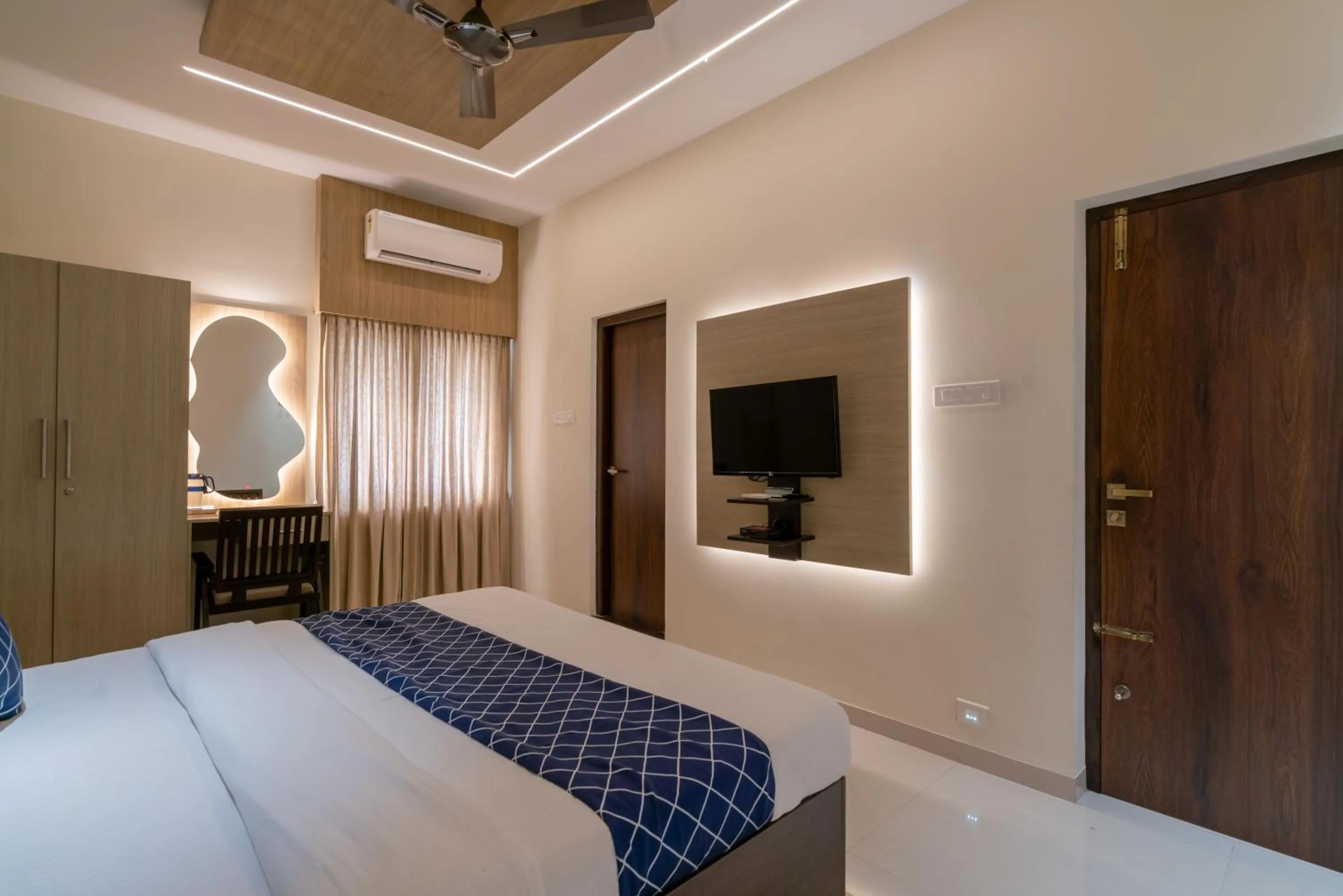 Bed in THE SURRYA MAX RESIDENCY