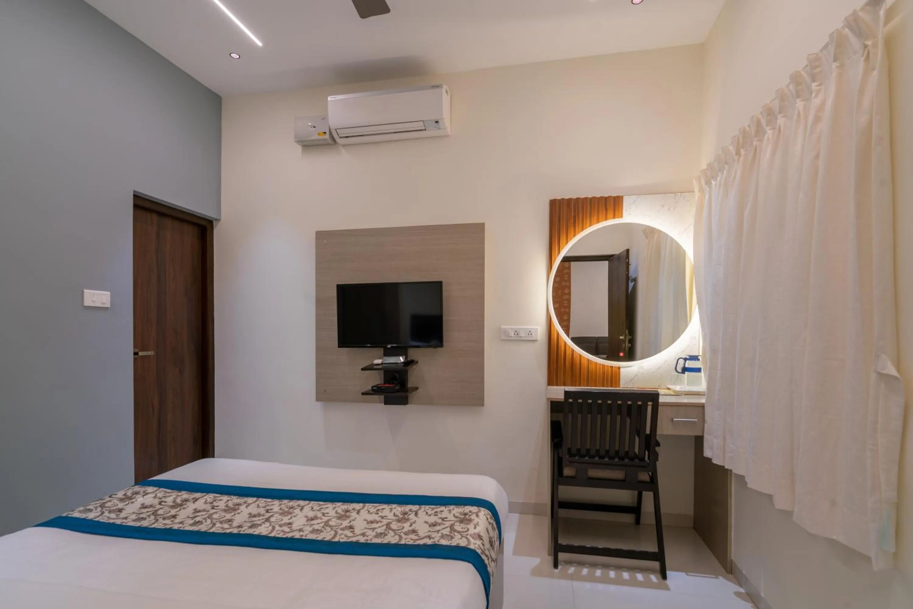 Bed in THE SURRYA MAX RESIDENCY