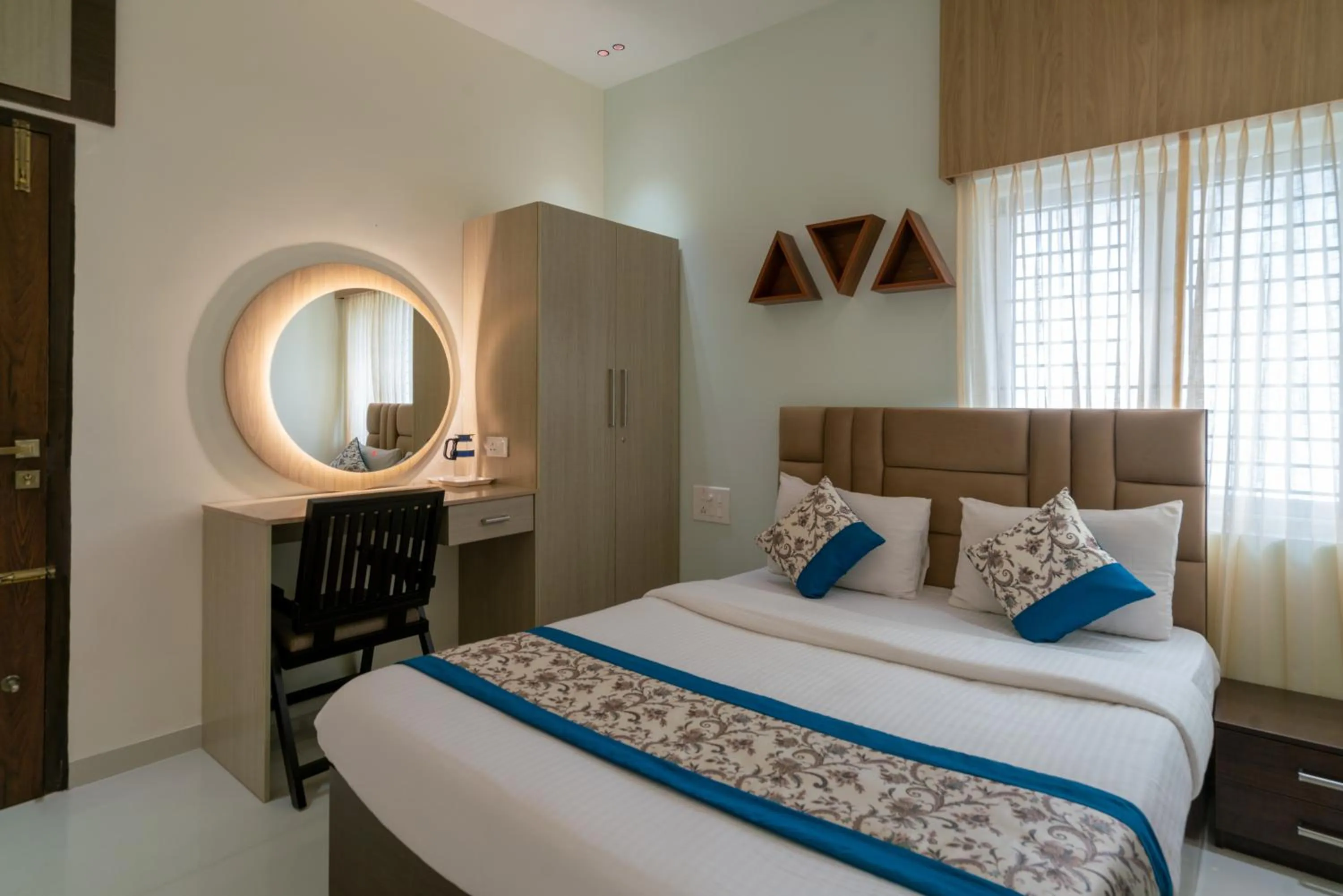 Bed in THE SURRYA MAX RESIDENCY