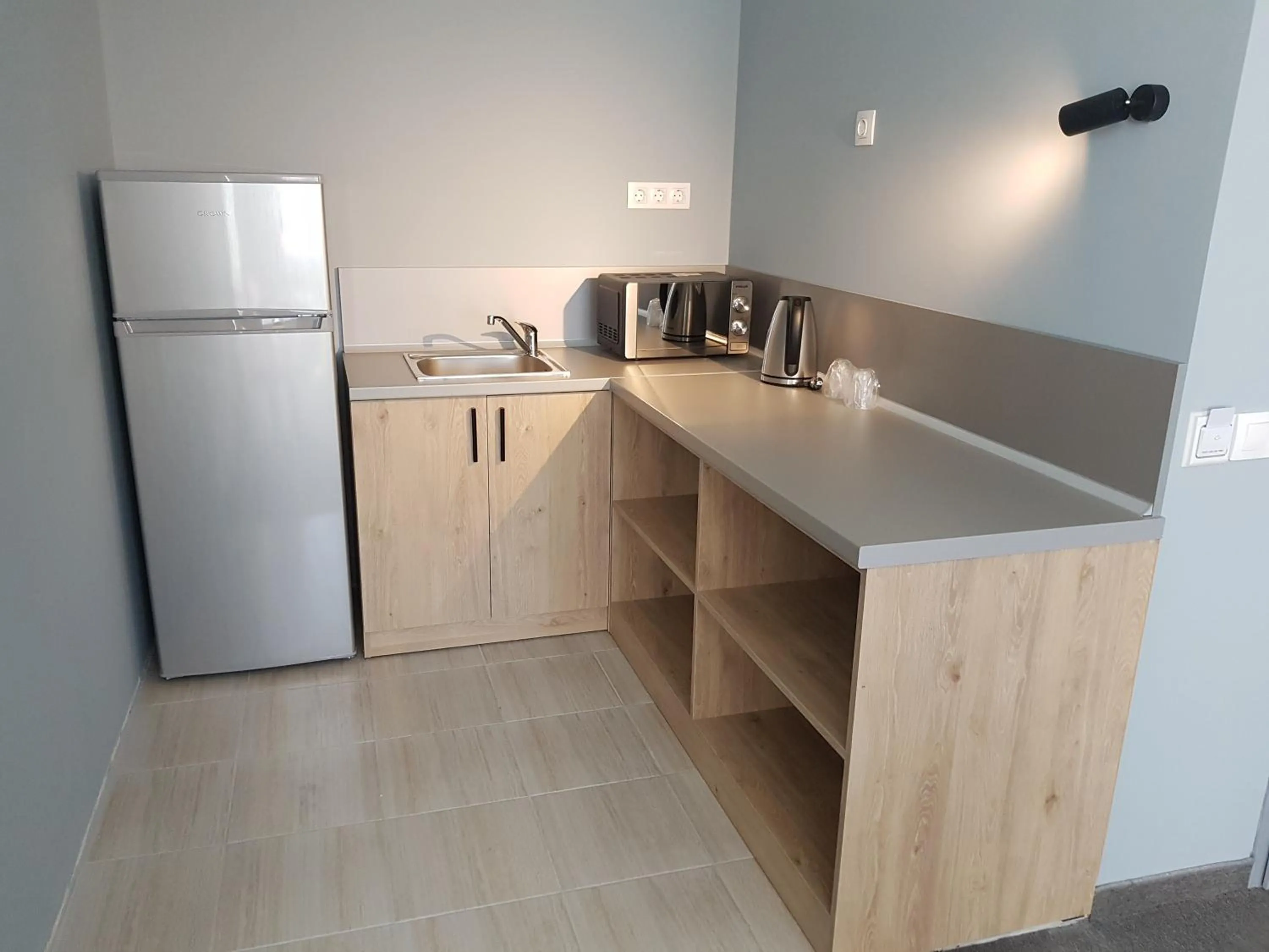 Kitchen or kitchenette in A&M Hotel with free parking