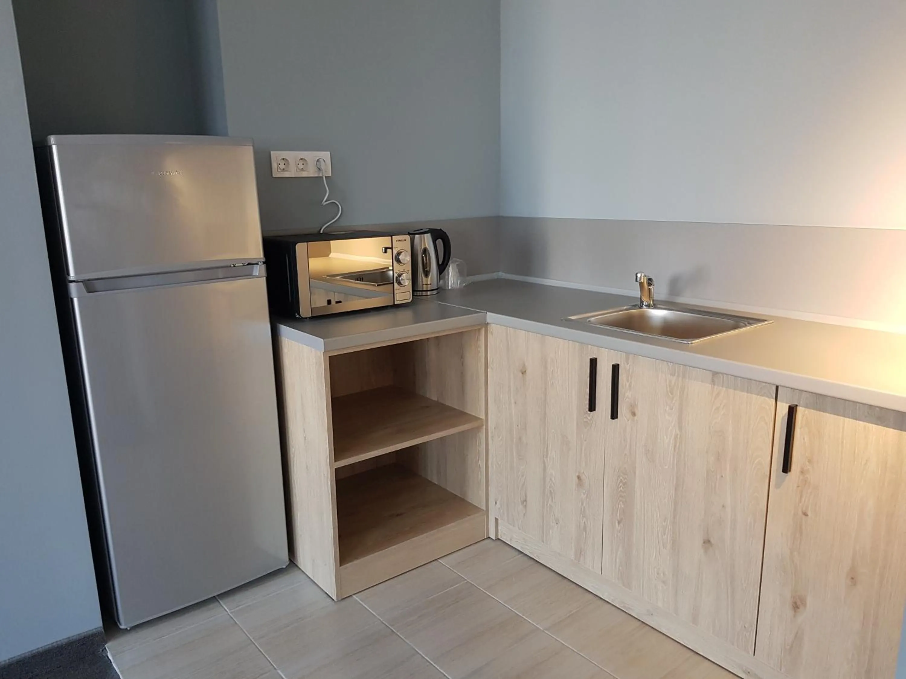 Kitchen or kitchenette in A&M Hotel with free parking