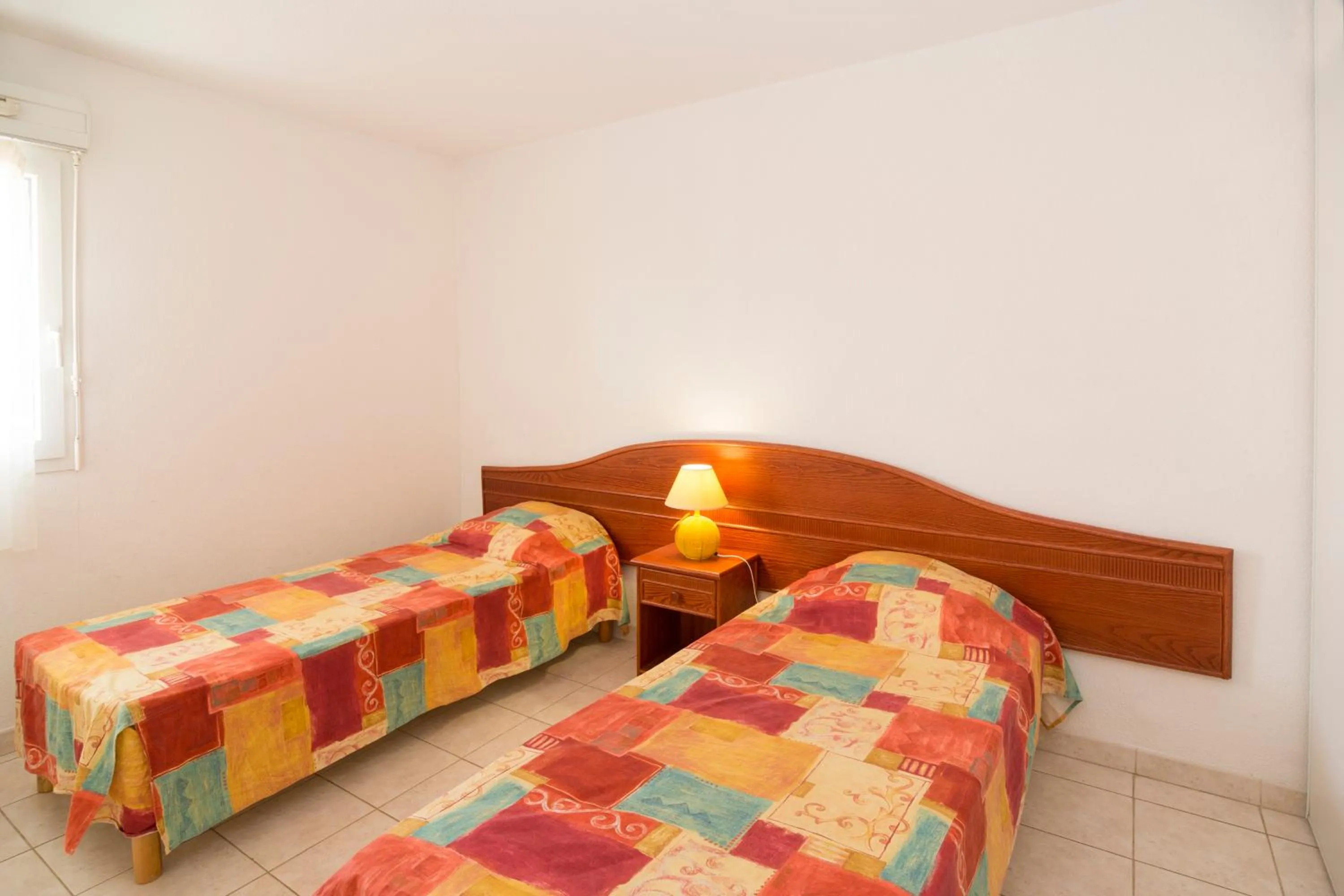 Bedroom, Bed in Vacancéole - Résidence Le Palmyra Golf