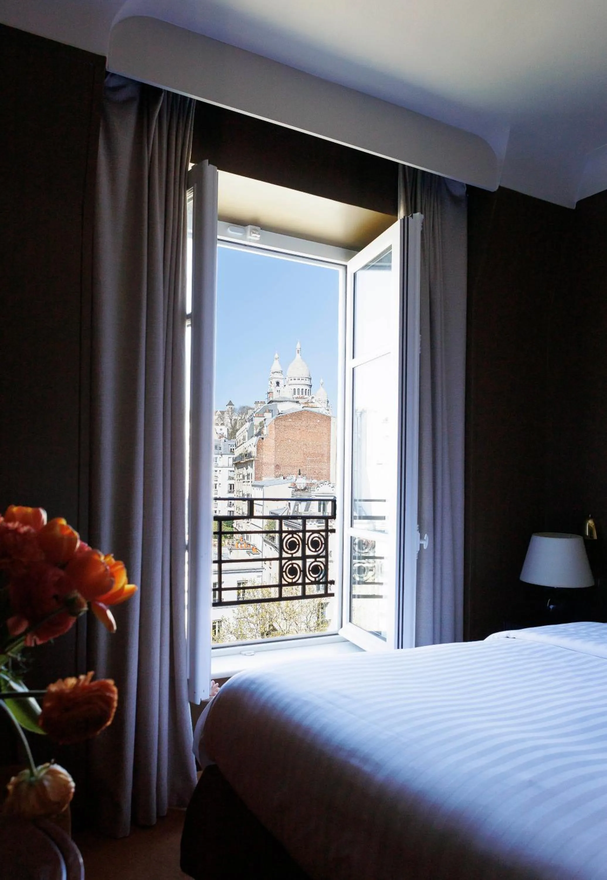 View (from property/room), Bed in Hotel Rochechouart, a Member of Design Hotels