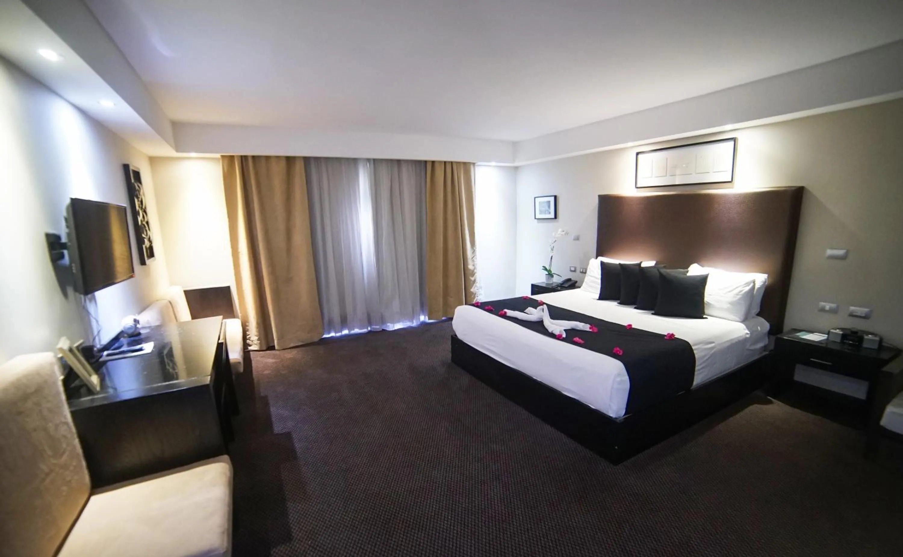 Bed in Savoy Hotel Boutique