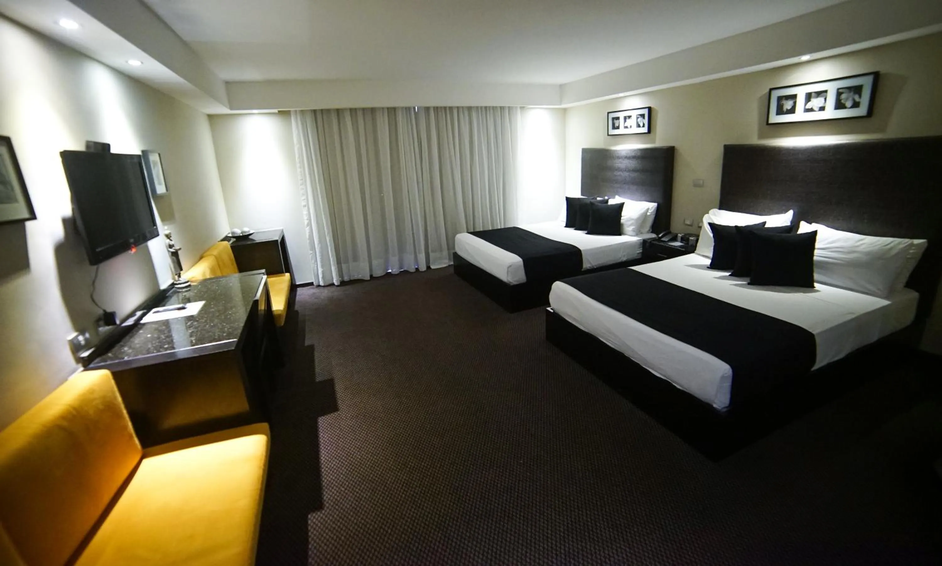 Bed in Savoy Hotel Boutique