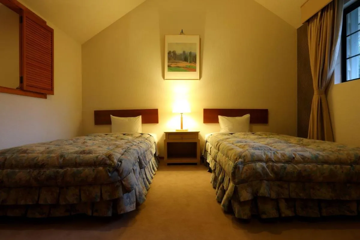 Bed in Hakuba Royal Suites