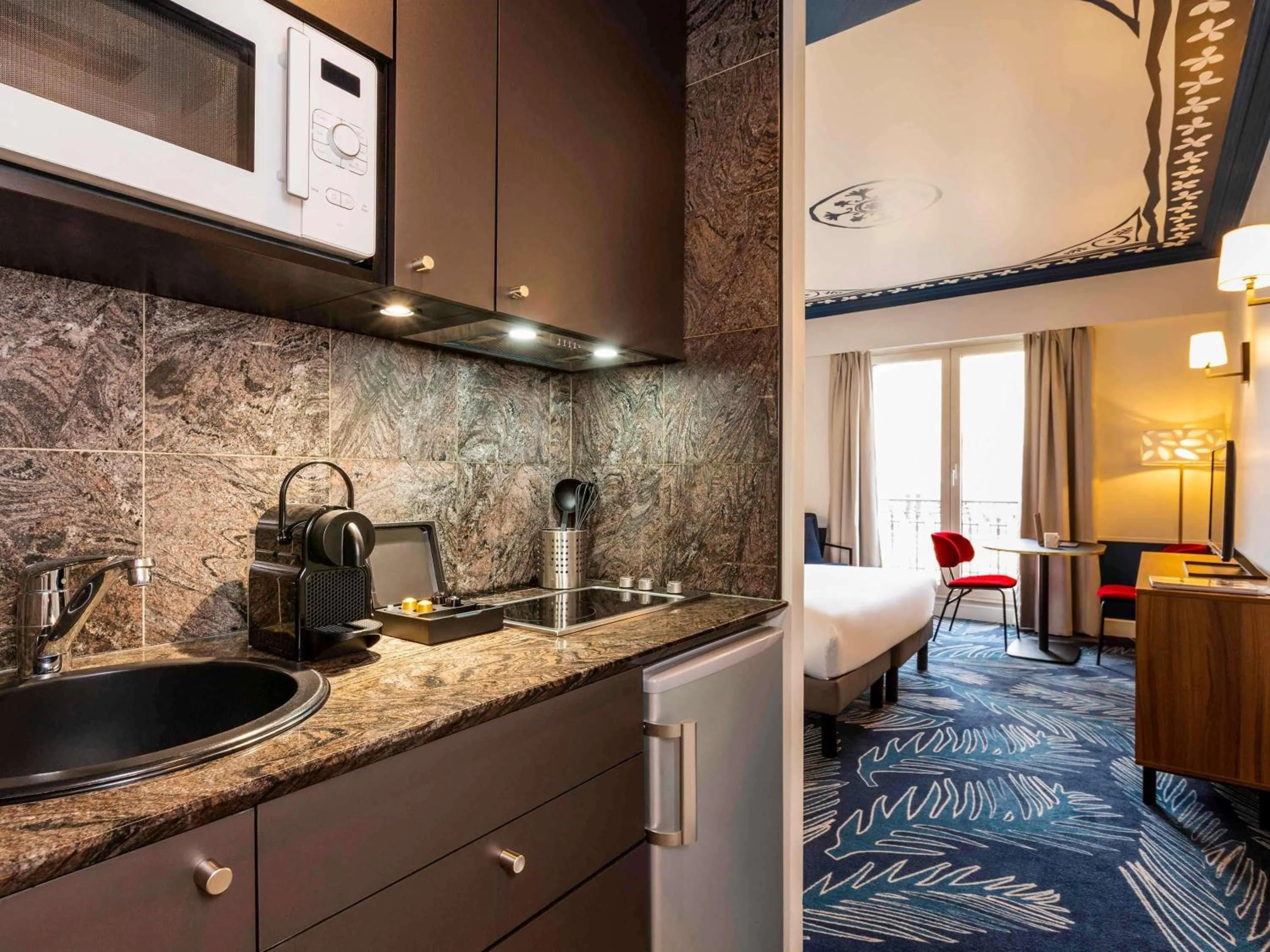 Bedroom in Aparthotel Adagio Paris Haussmann Champs Elysées