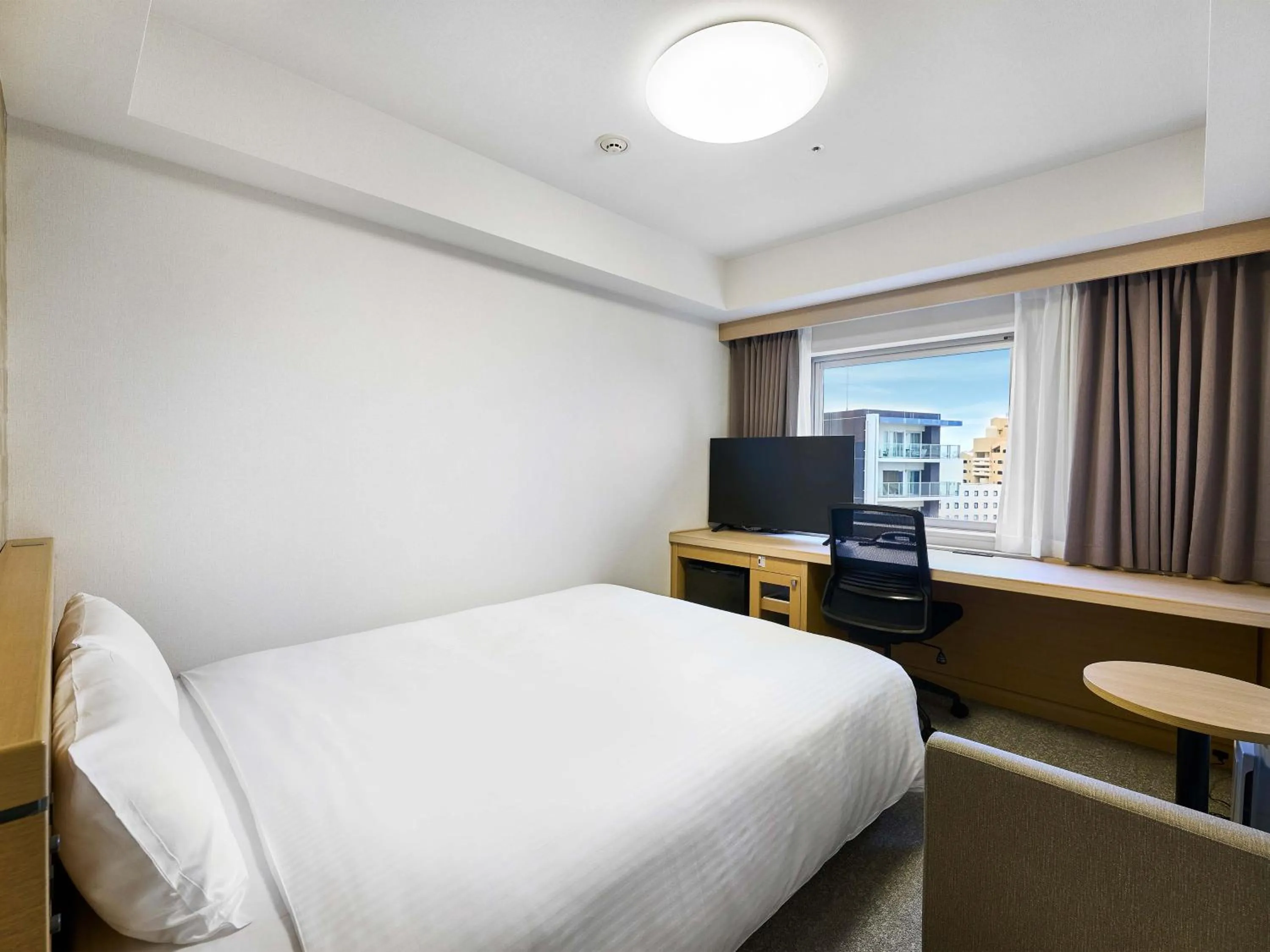 Bed in Daiwa Roynet Hotel Naha Kokusaidori