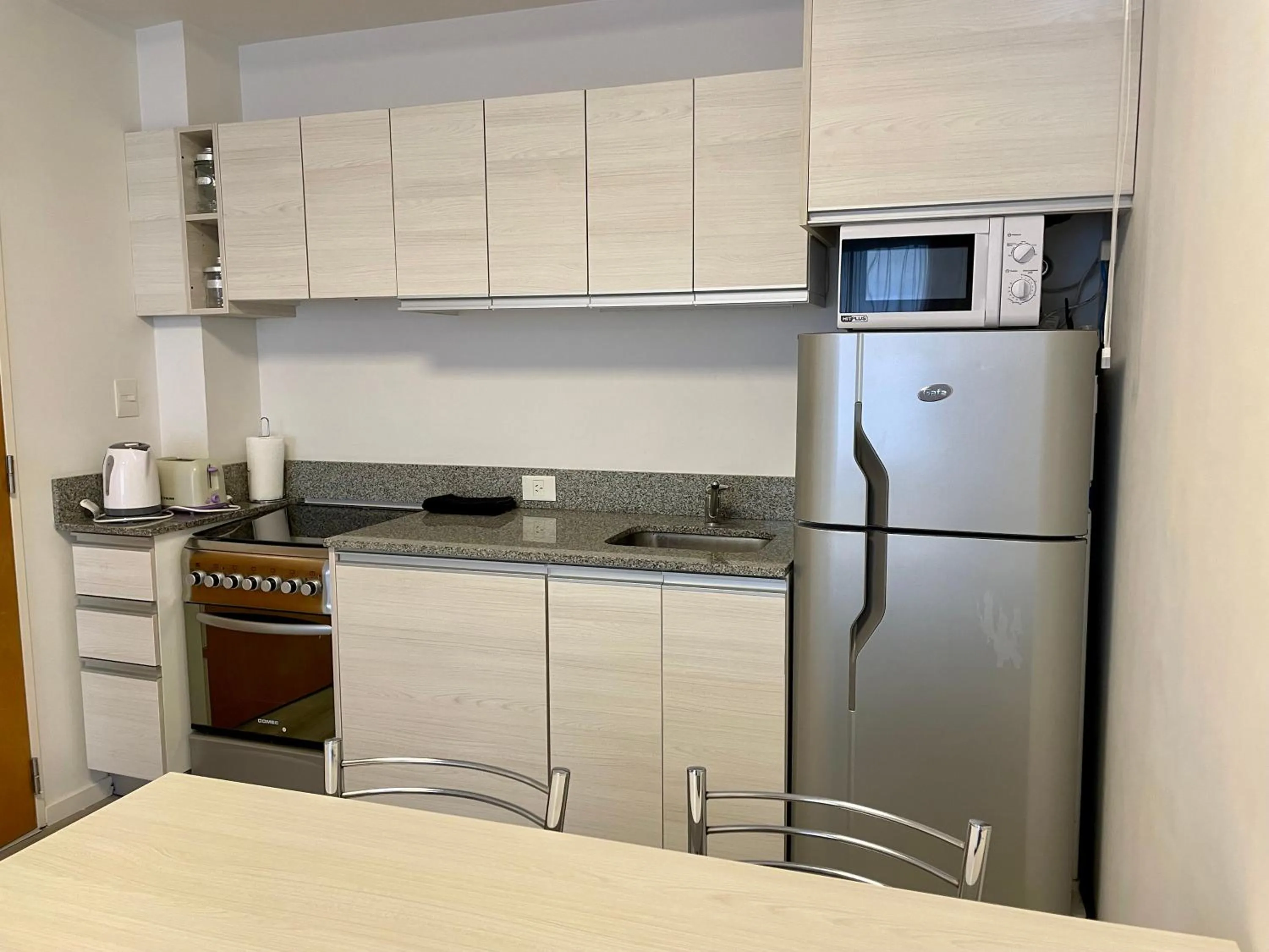 Kitchen or kitchenette in Monroe Suites