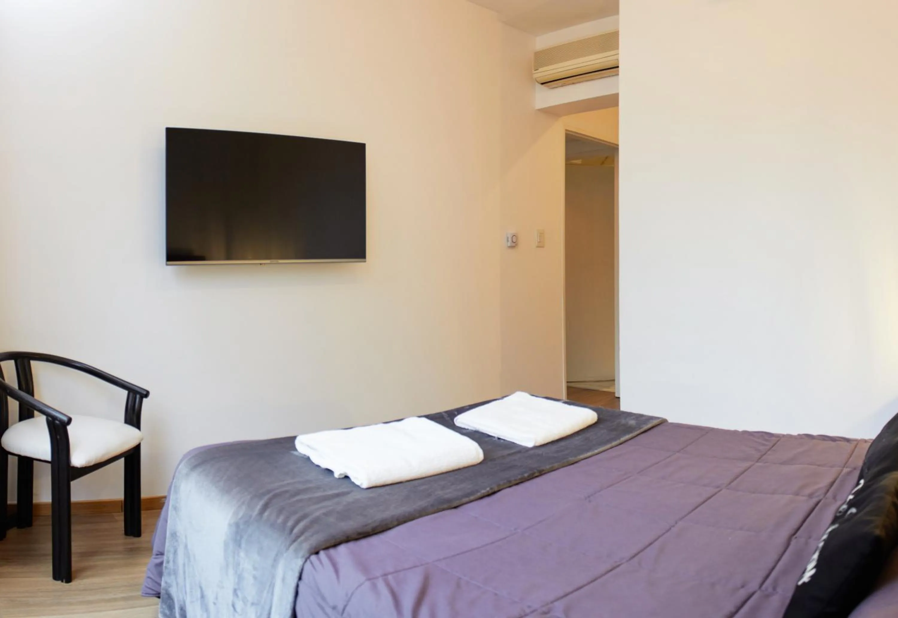 Bed in Monroe Suites