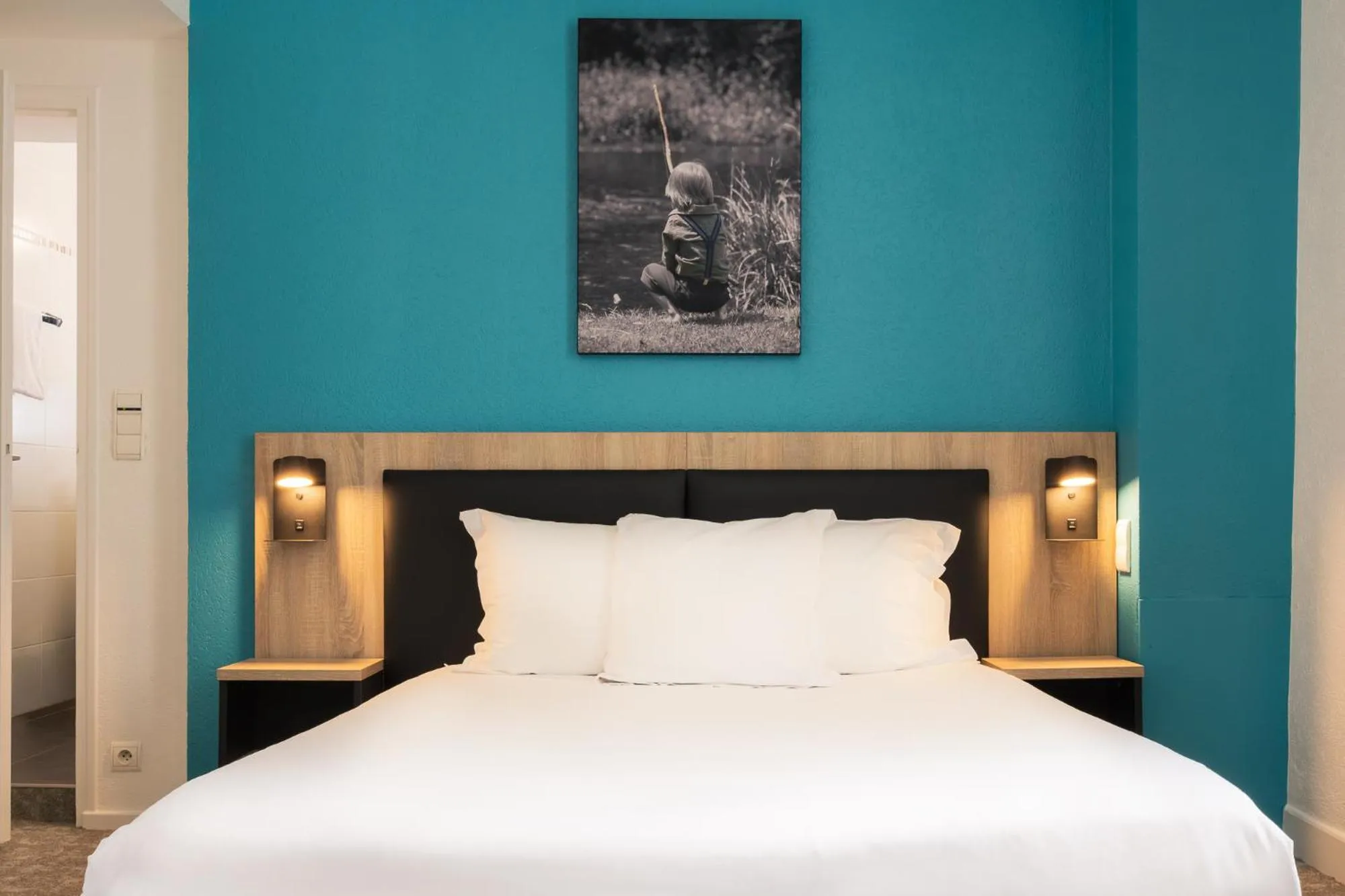 Bed in Hôtel de France - Le Patriarche