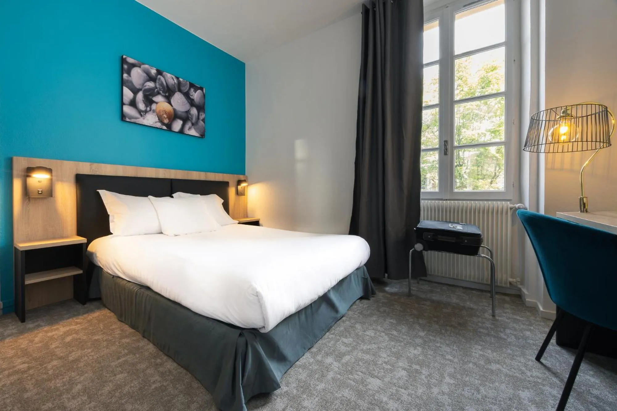 Bed in Hôtel de France - Le Patriarche