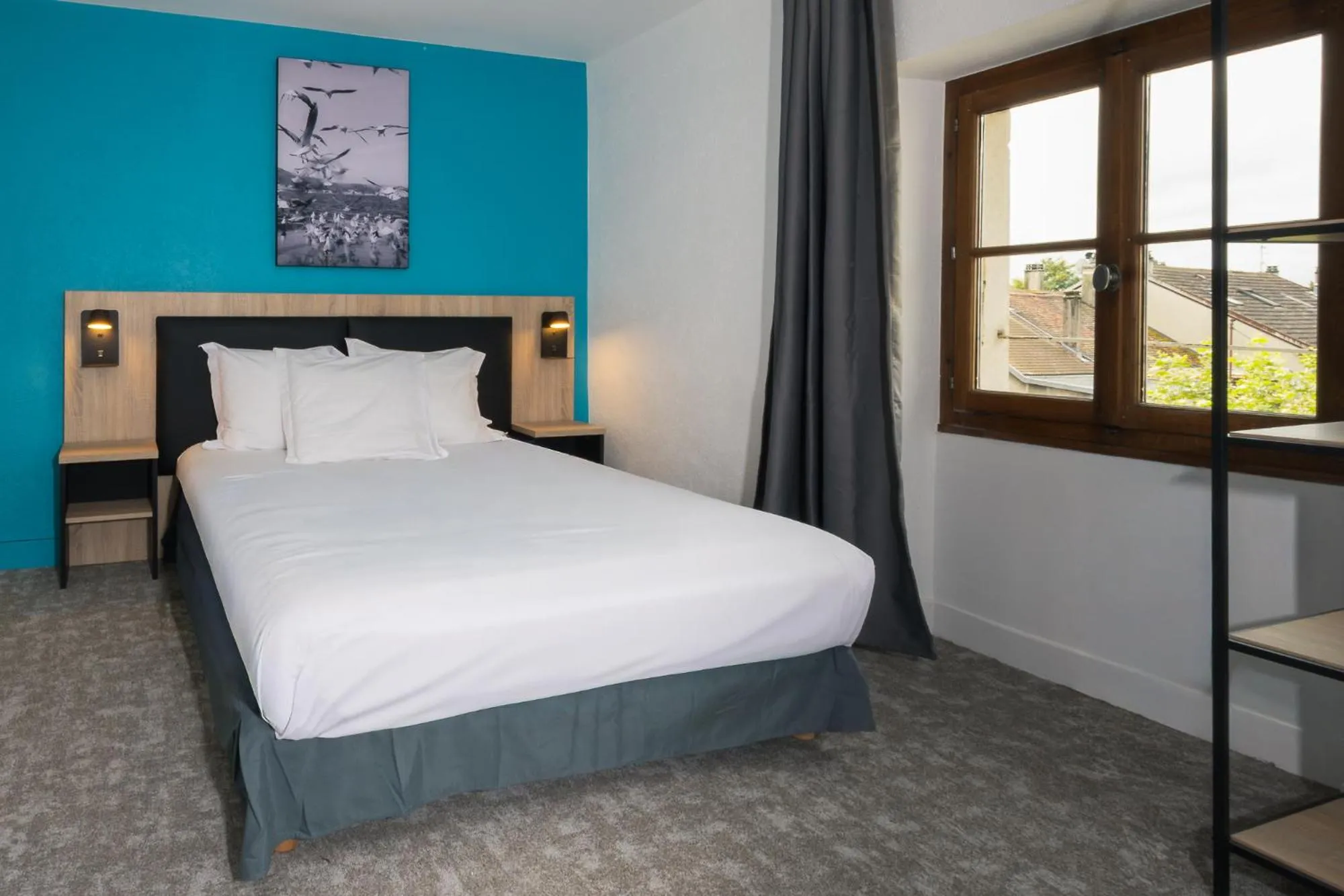 Bed in Hôtel de France - Le Patriarche