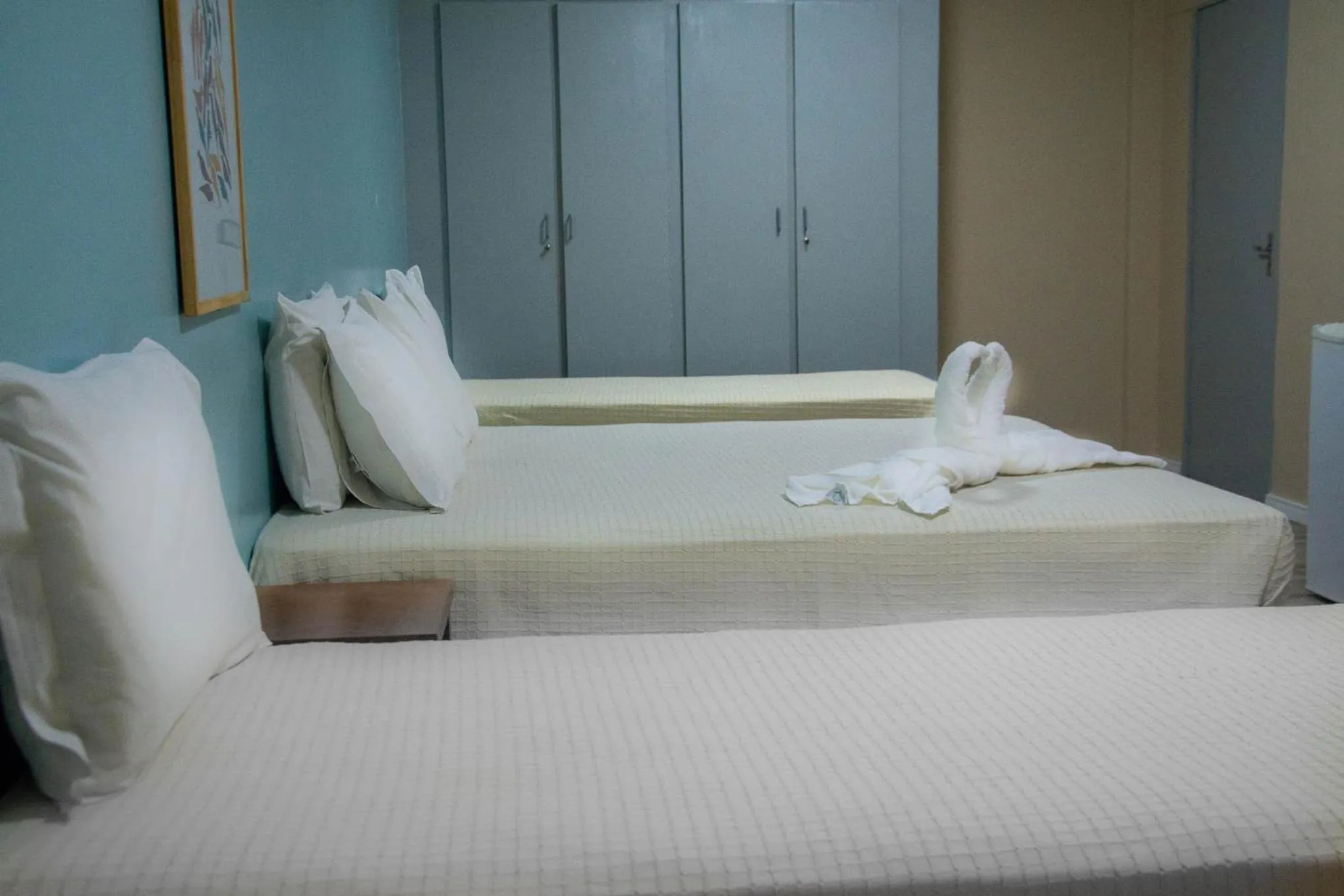 Quadruple Room with four single beds in Nordeste Palace Hotel