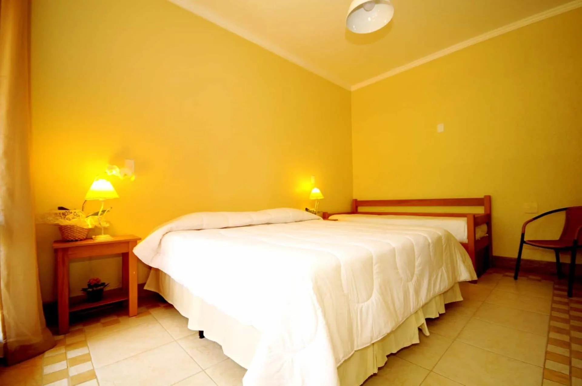 Bed in Pousada Pelicano