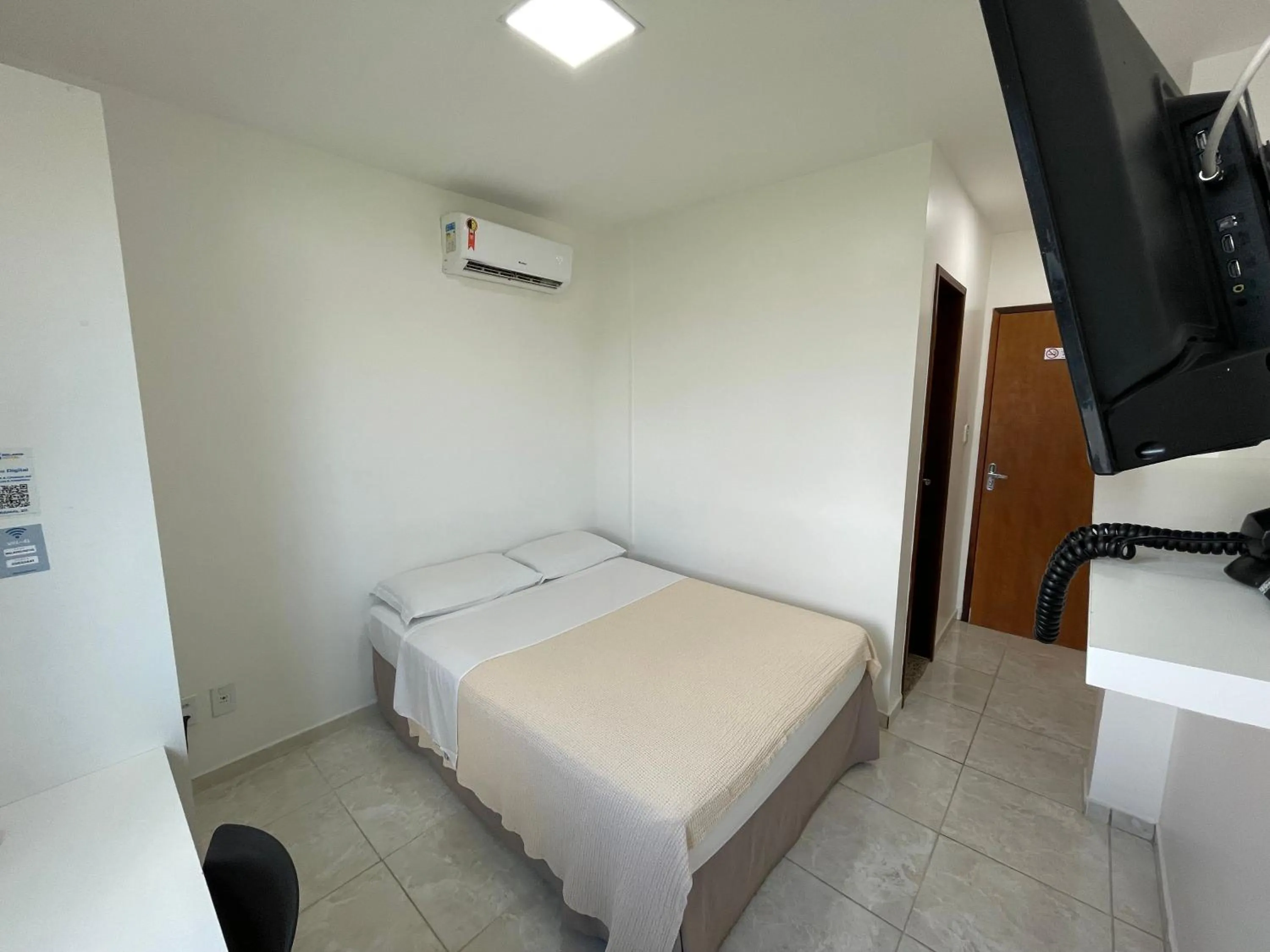 Bed in Belaris Hotel