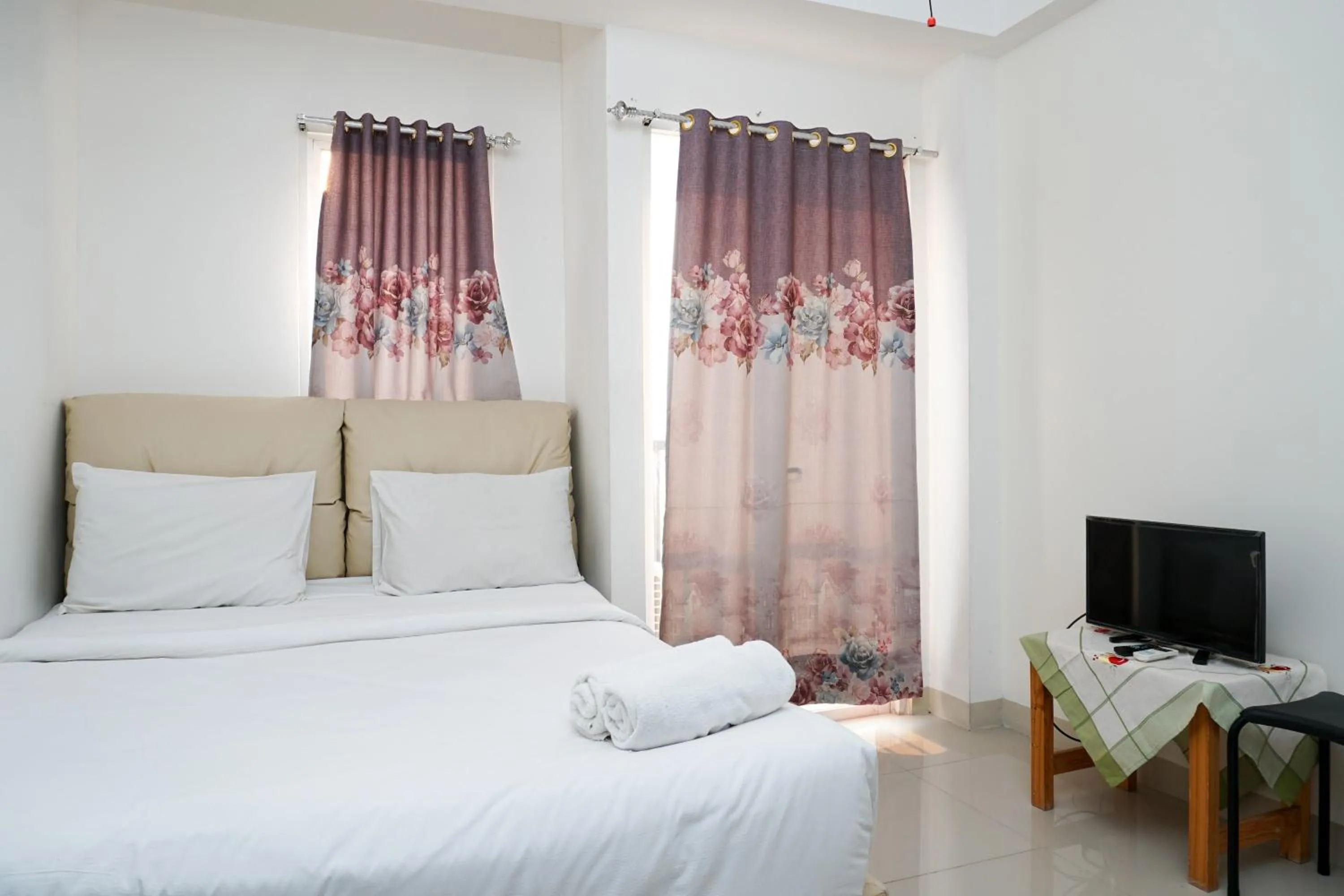 Bed in City View Studio Apartment at Signature Park Grande By Travelio