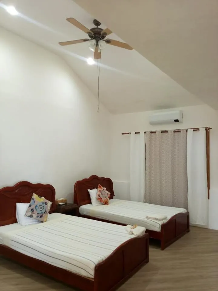 Bed in VILLA MARMARINE BEACH RESORT & RESTAURANT