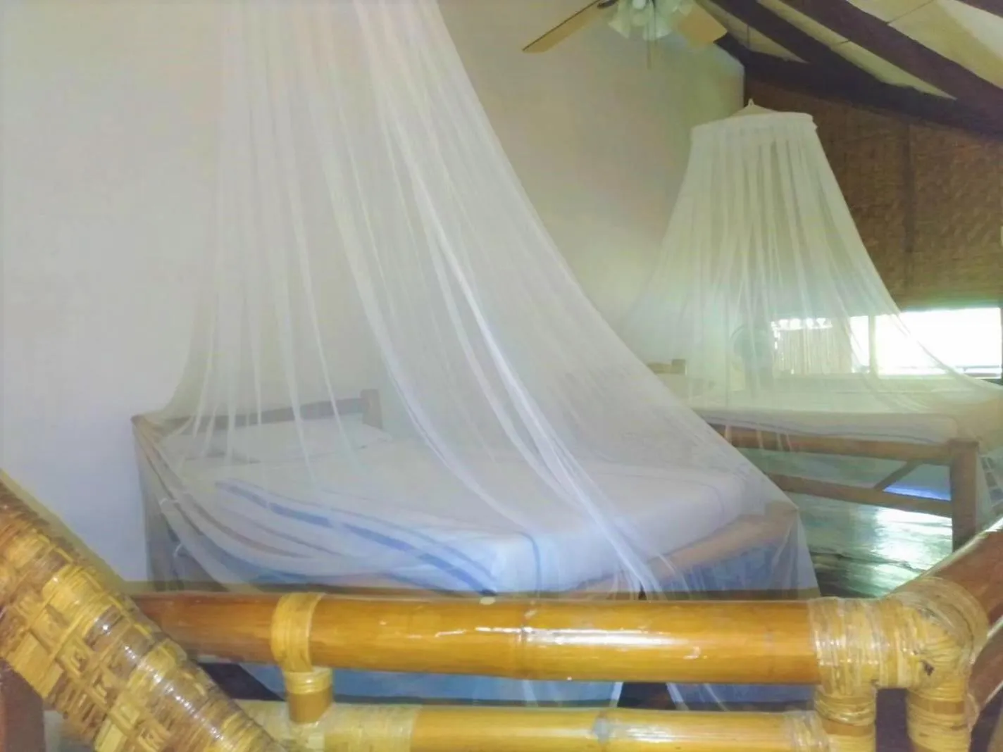 Bed in VILLA MARMARINE BEACH RESORT & RESTAURANT