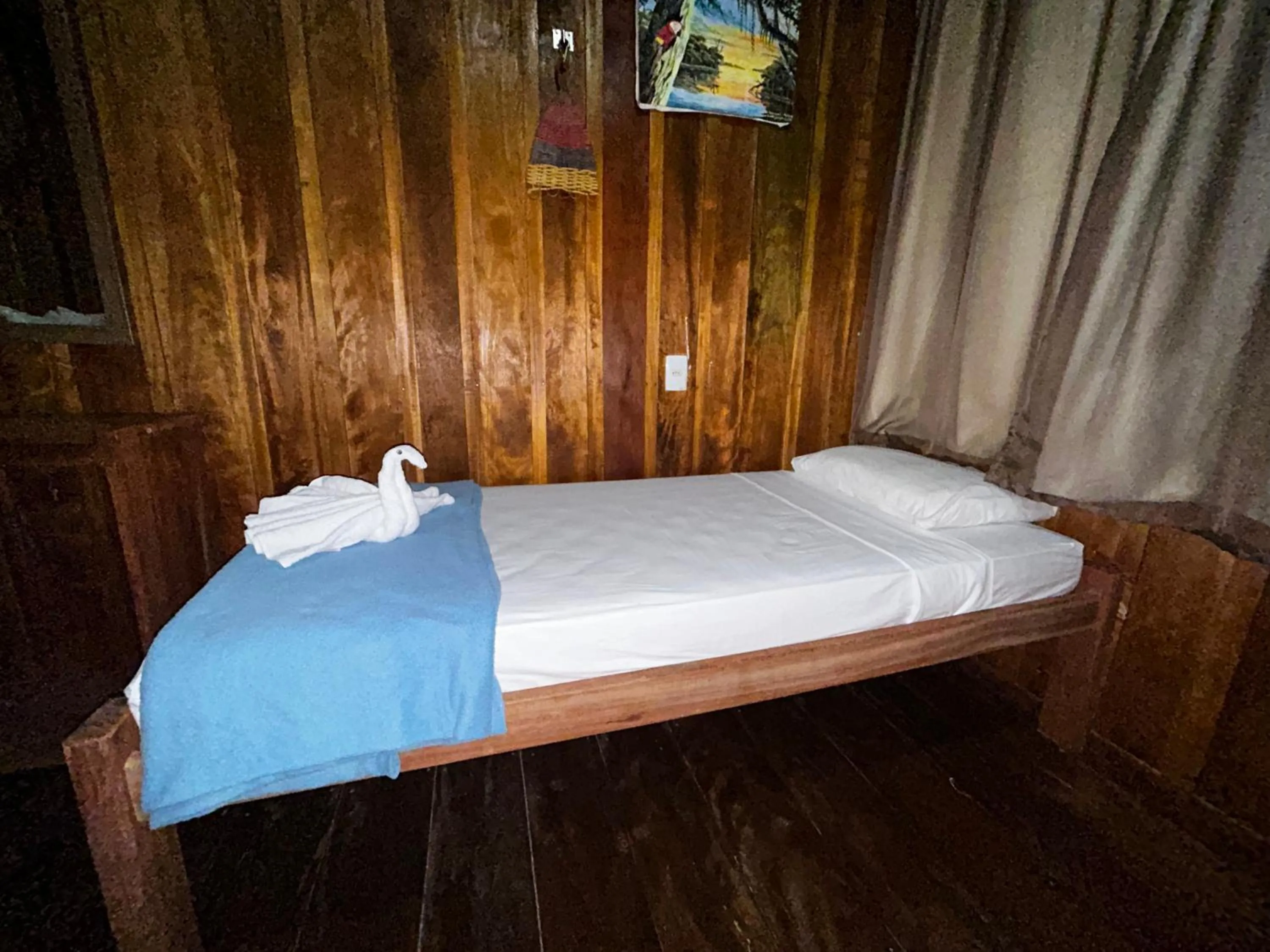 Bed in Vista do Lago Jungle Lodge