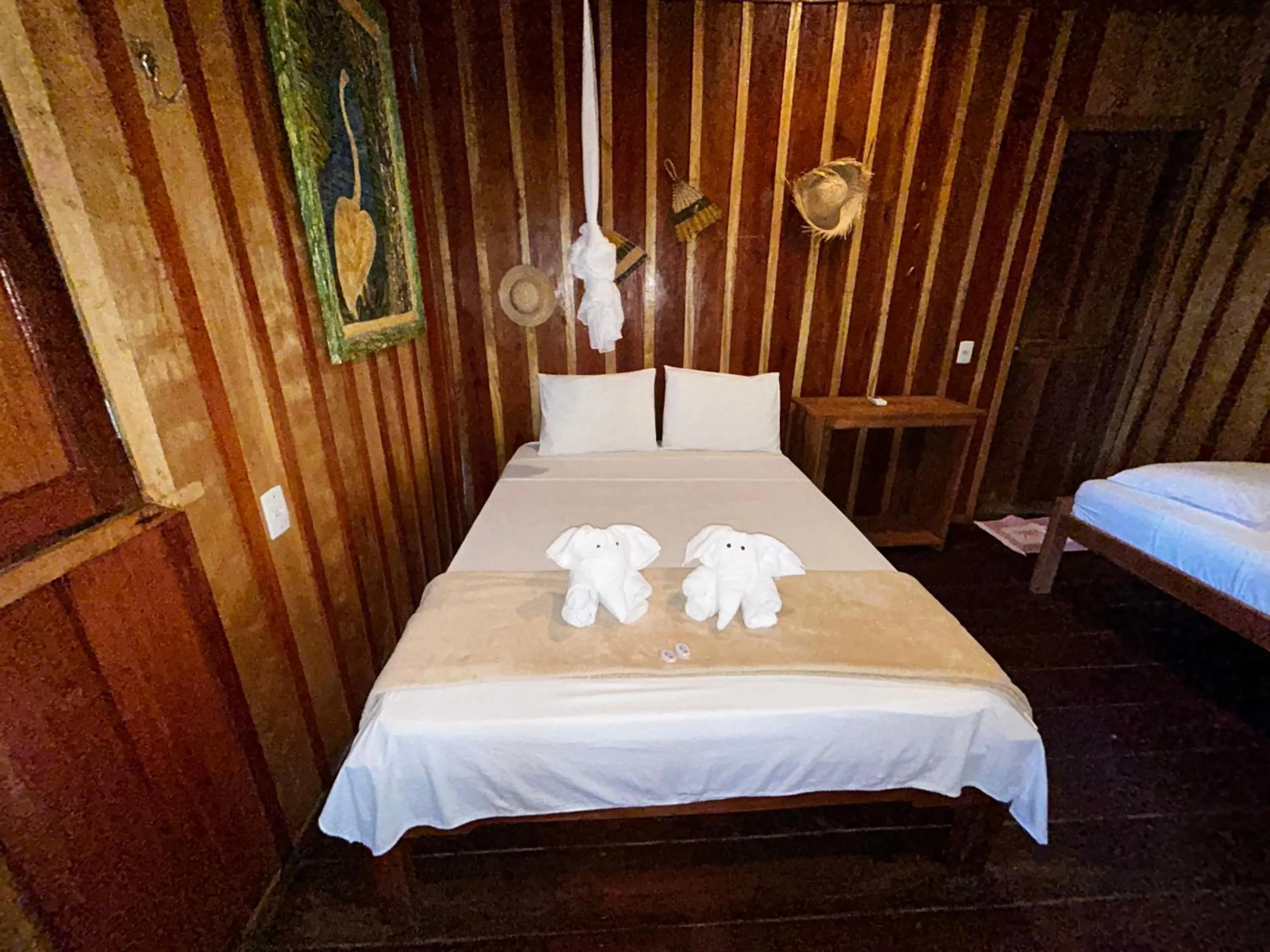 Bed in Vista do Lago Jungle Lodge