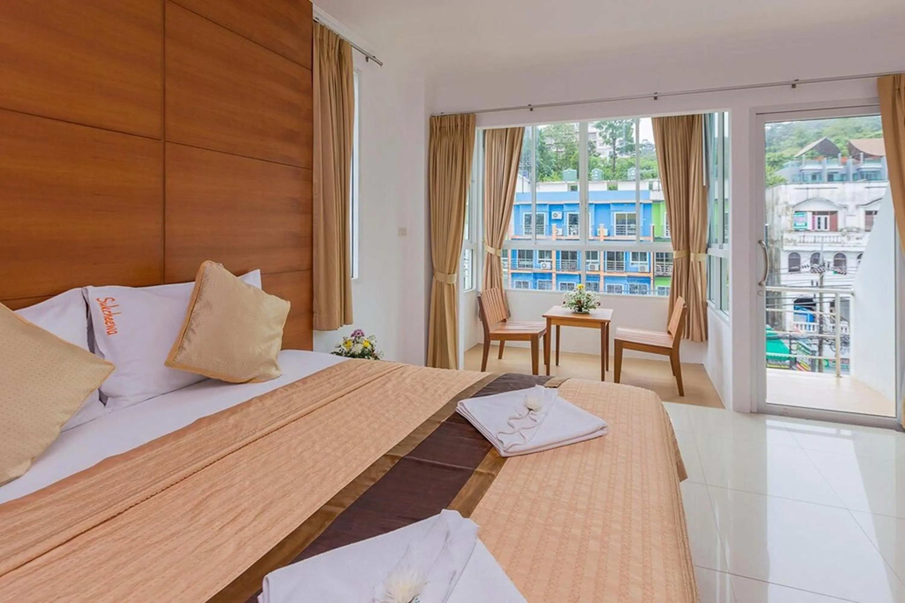 Bed in Sukcheewa Residence Phuket