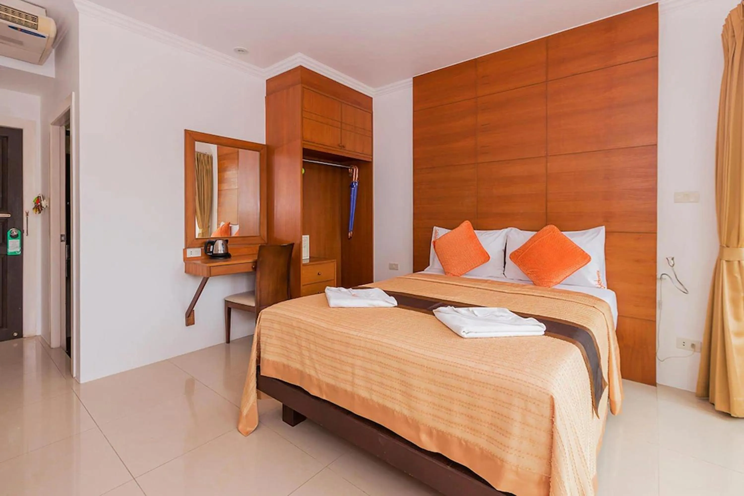 Bed in Sukcheewa Residence Phuket