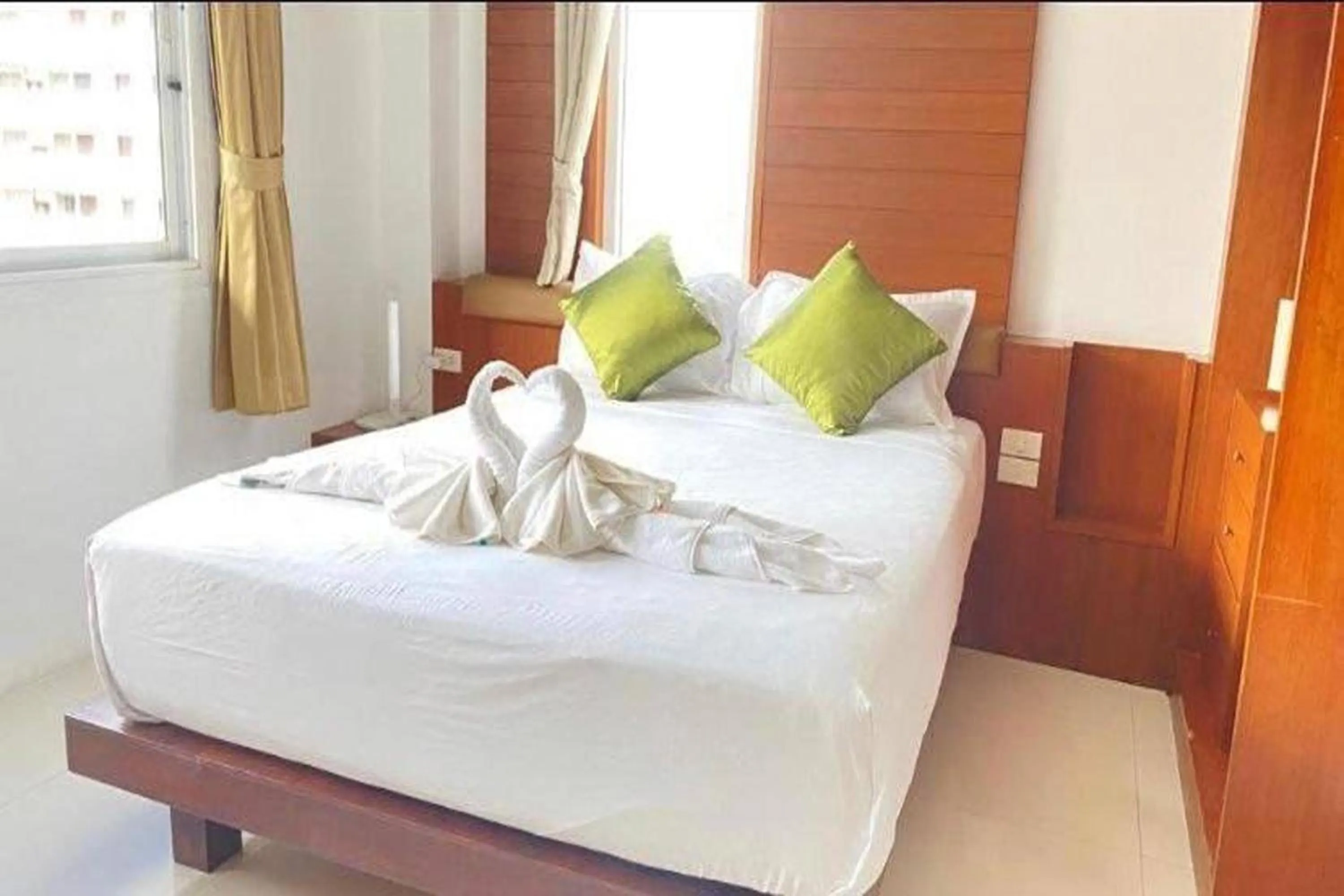 Bed in Sukcheewa Residence Phuket