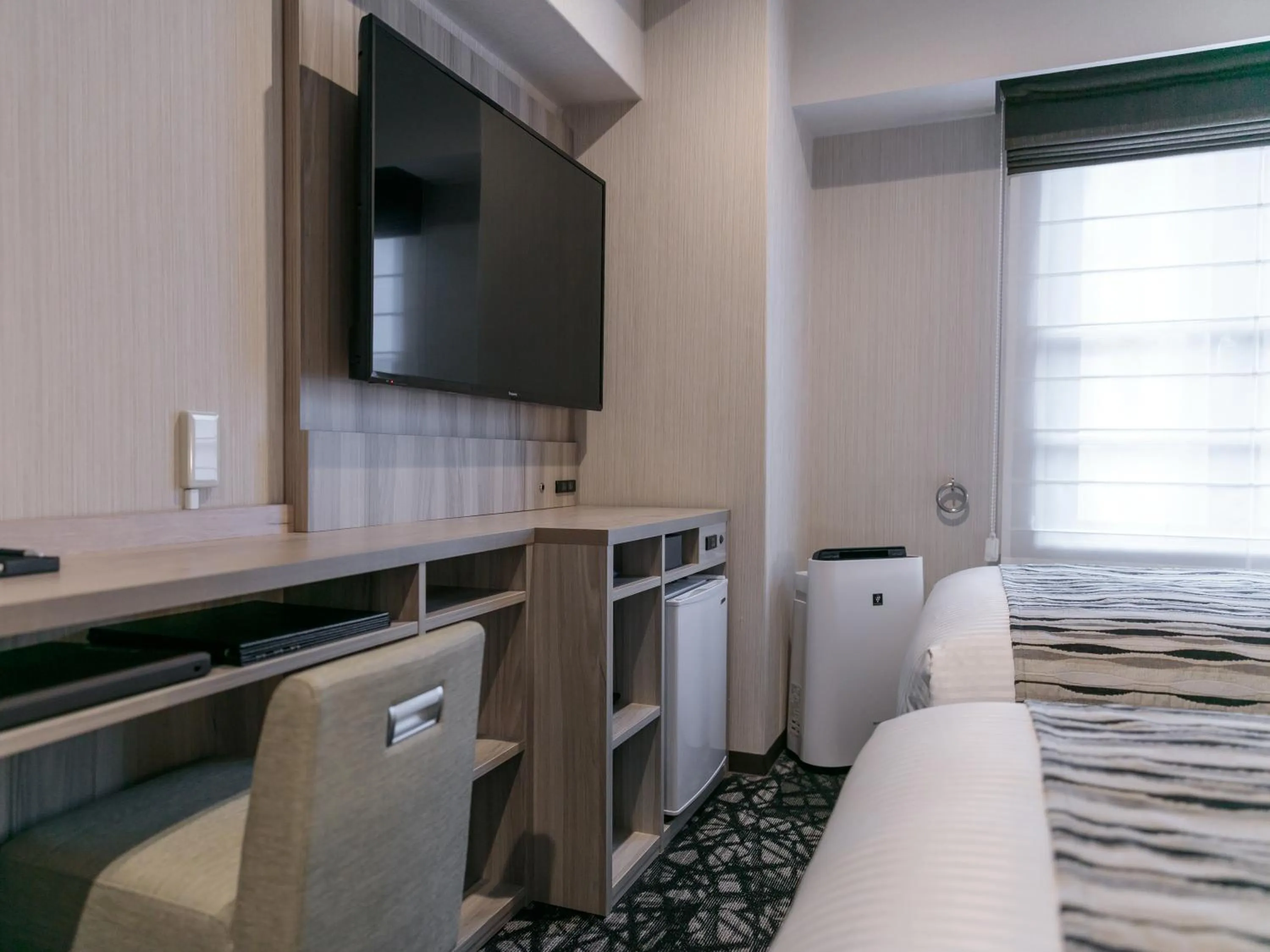 Photo of the whole room, TV/Entertainment Center in Cent Inn Nibankan