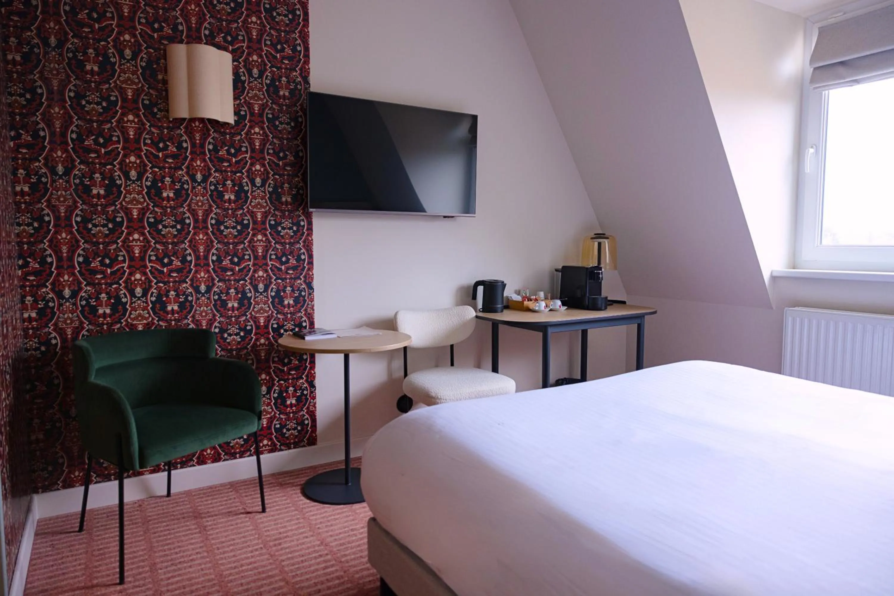 Bed in Logis Hotel L'Ours de Mutzig