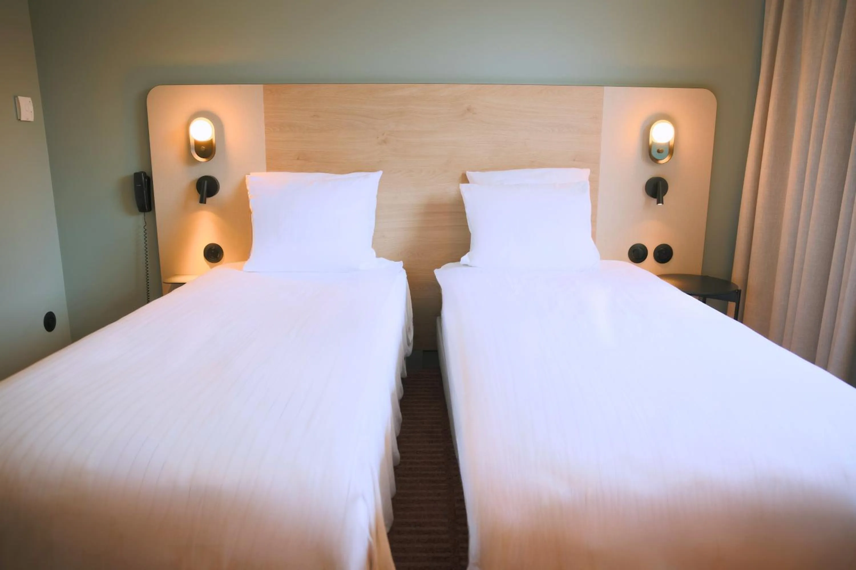 Bed in Logis Hotel L'Ours de Mutzig