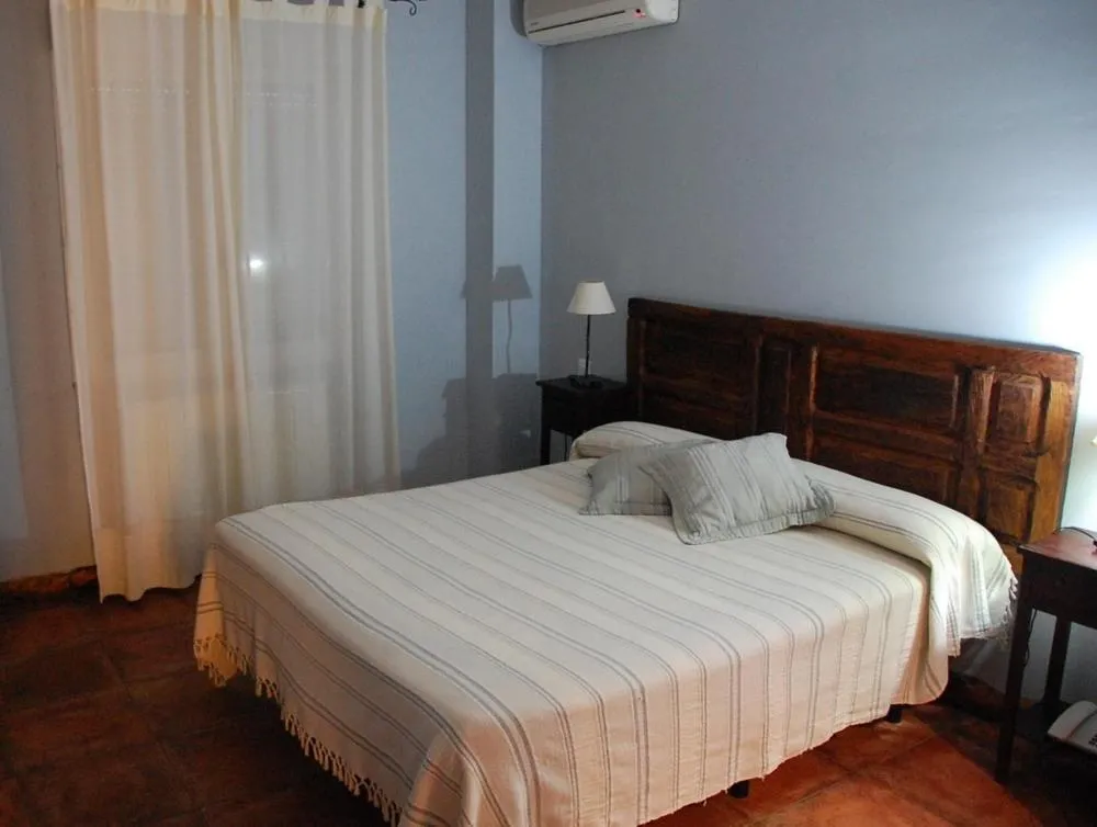 Bed in Posada Tresmentiras