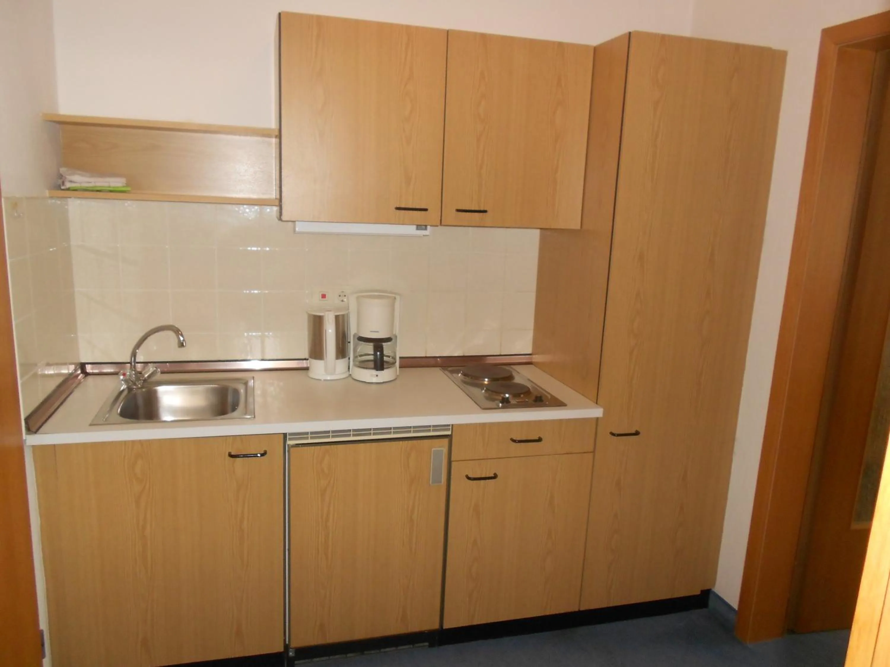 Kitchen or kitchenette in Hotel Fortuna
