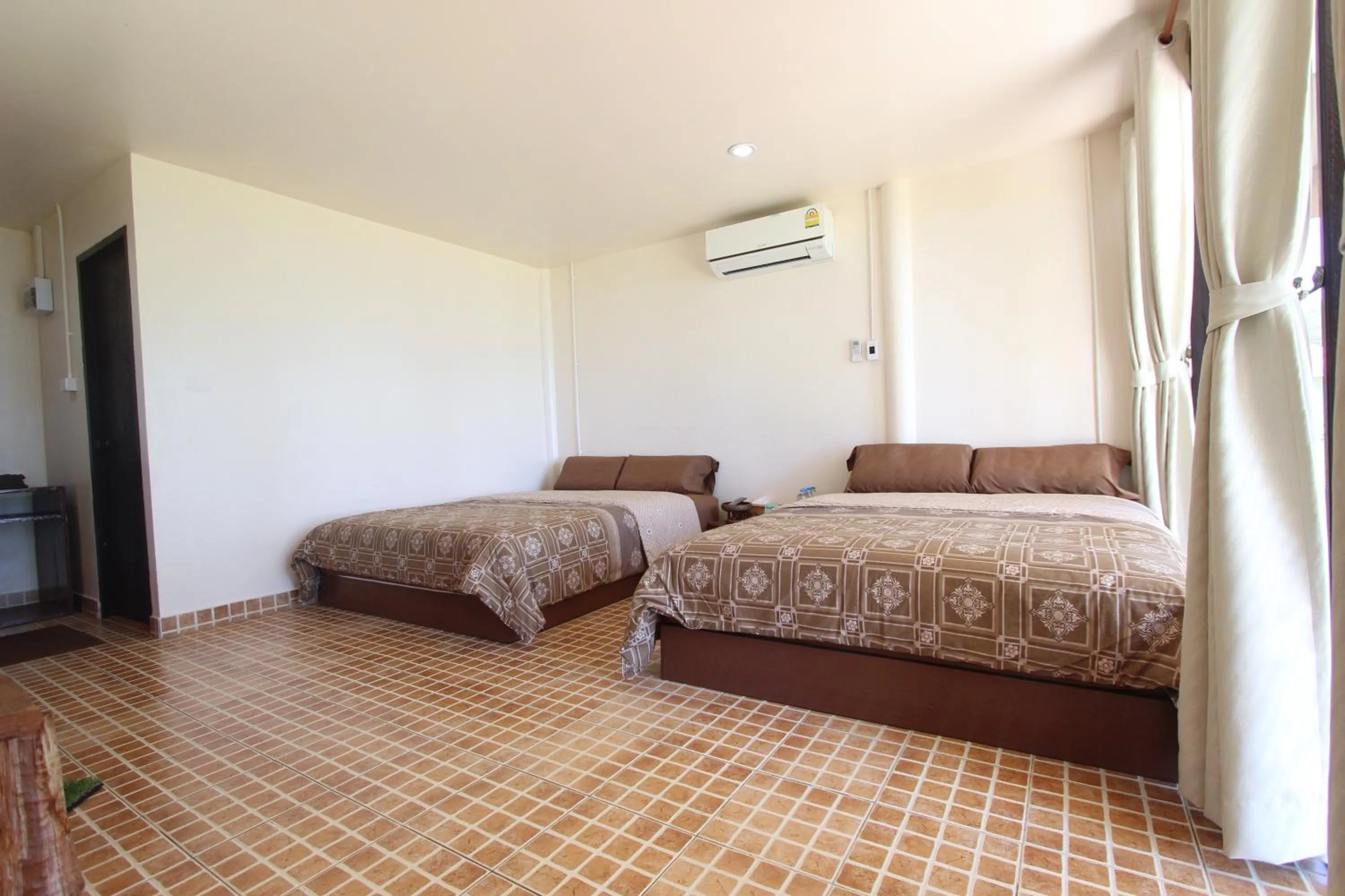 Bed in TK Beach Resort Koh Mak