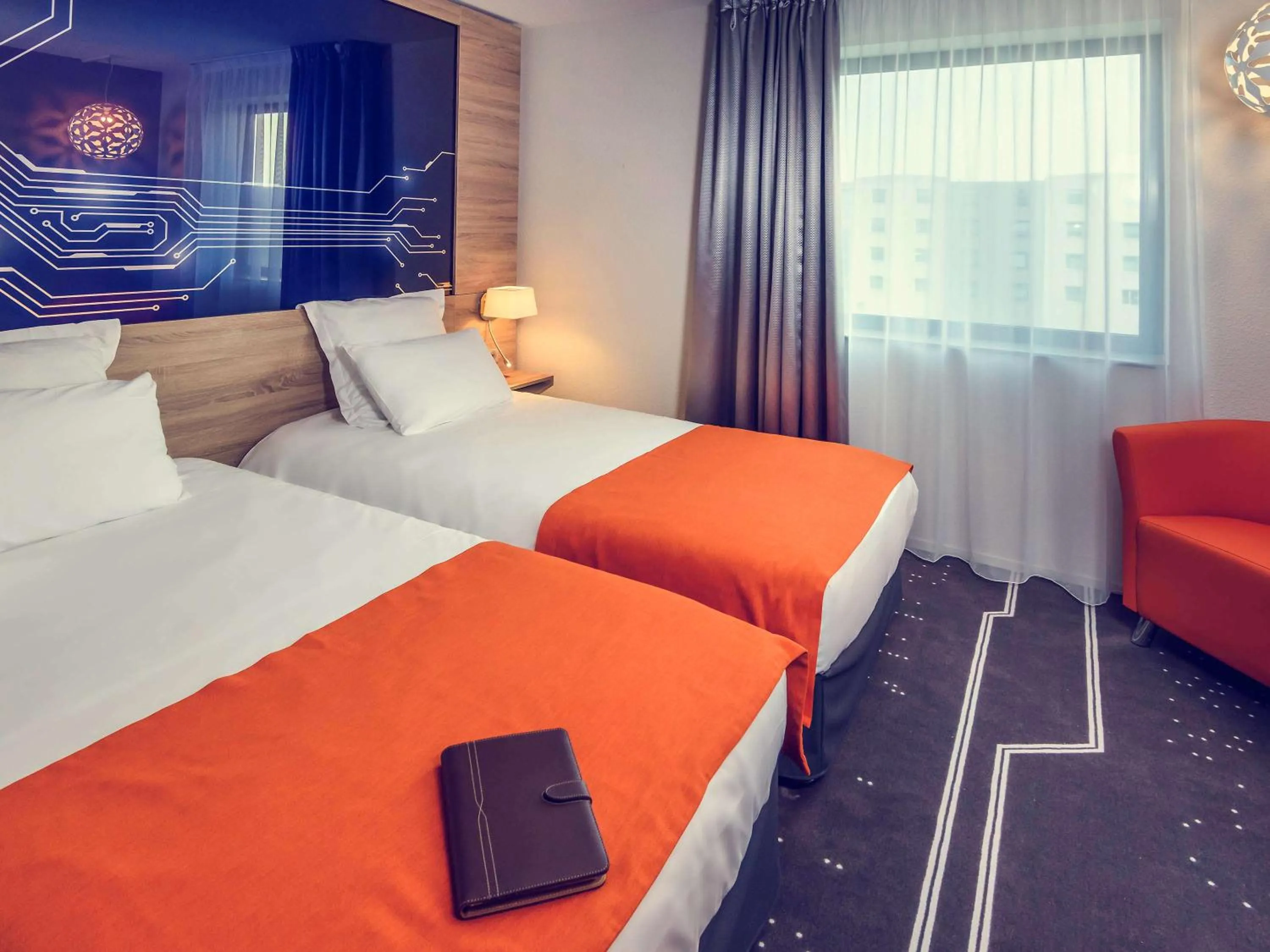 Photo of the whole room, Bed in Mercure Poitiers Site du Futuroscope