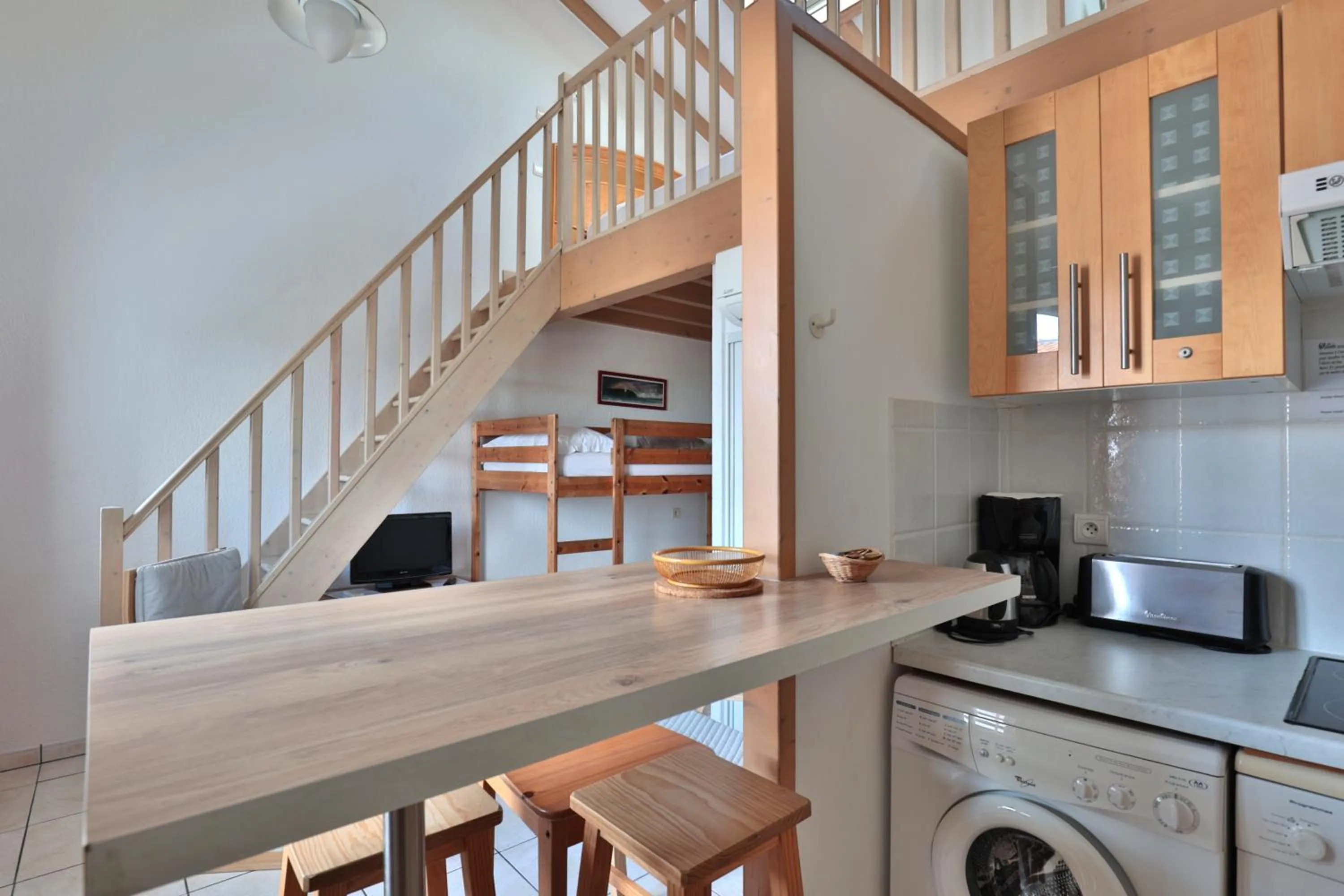 Kitchen or kitchenette in Hôtel & Appart-hôtel Olatua