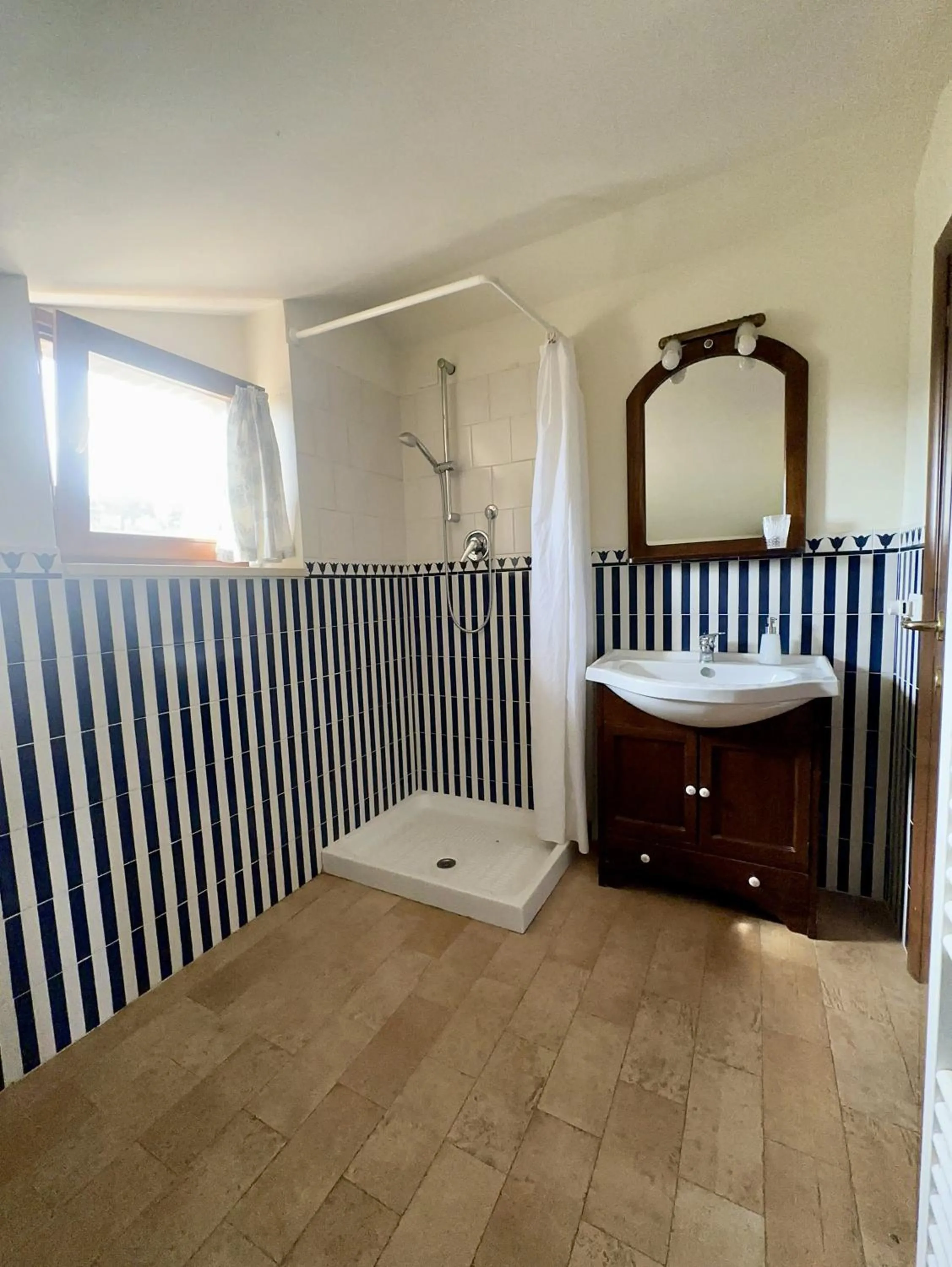 Shower in Cumana Blu Apartments