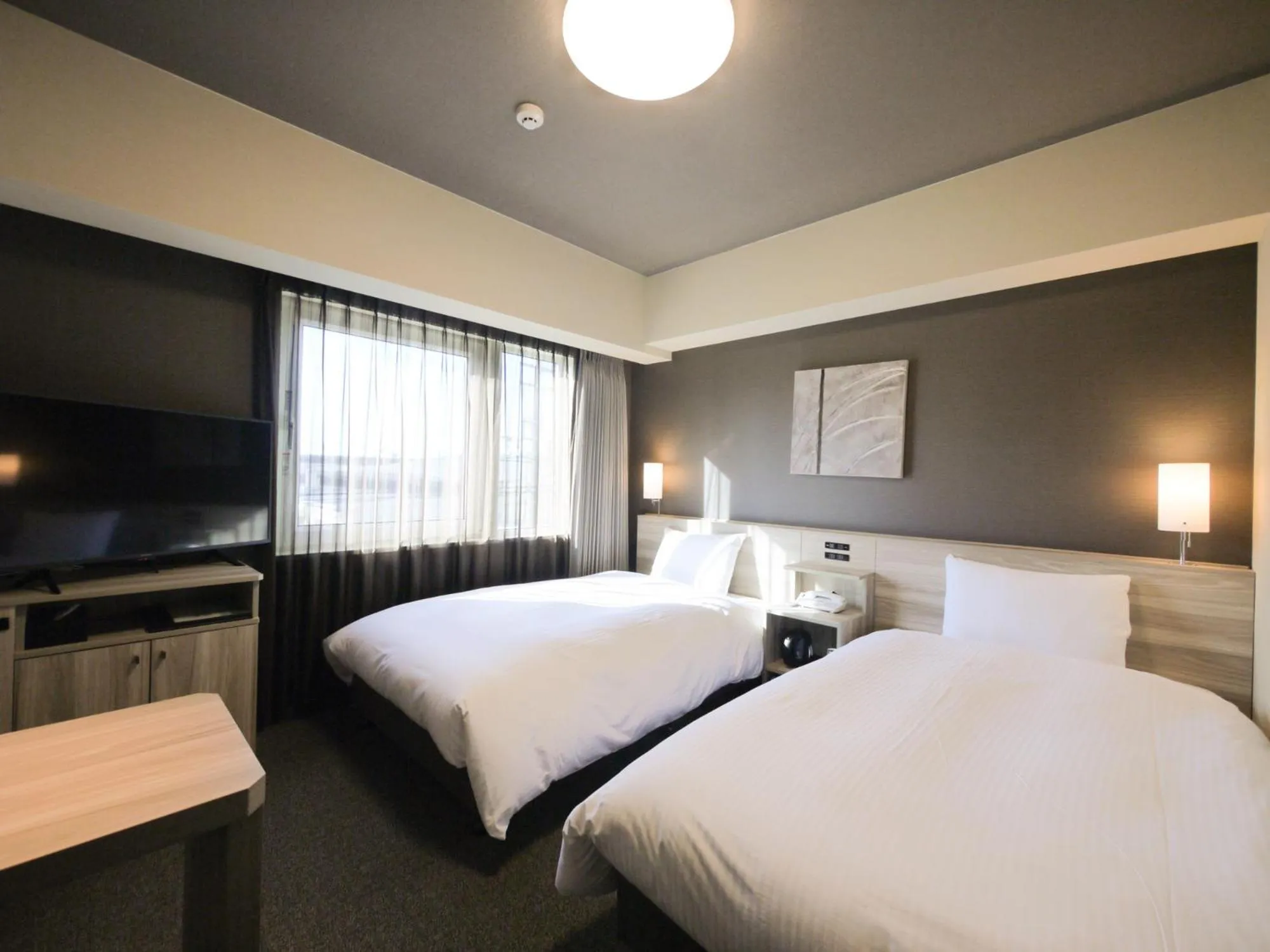Photo of the whole room, Bed in Hotel Route-Inn Osaka Kishiwada -Higashikishiwada Ekimae Kansai Airport-