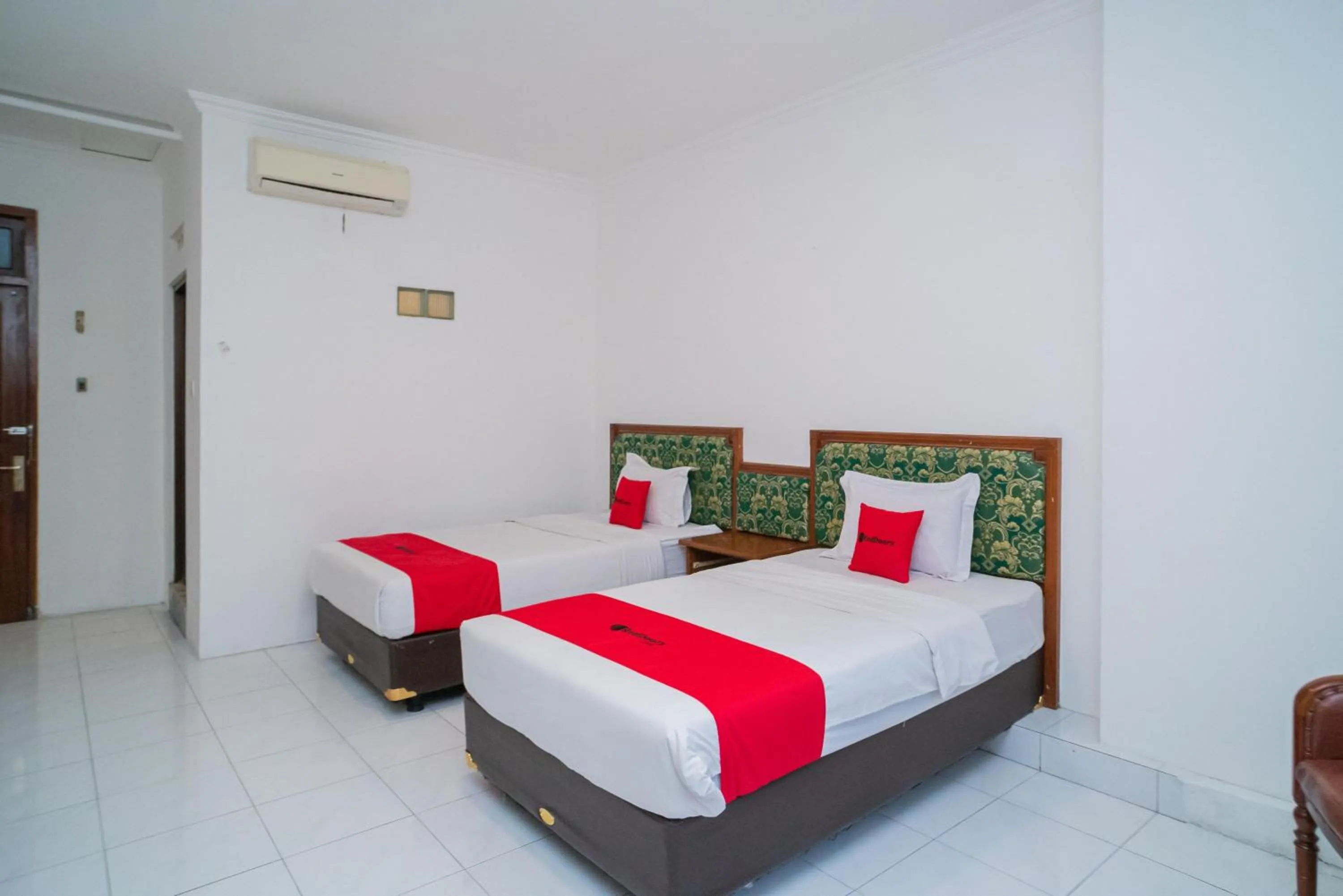 Bedroom, Bed in RedDoorz Plus at Hotel Surya Solo