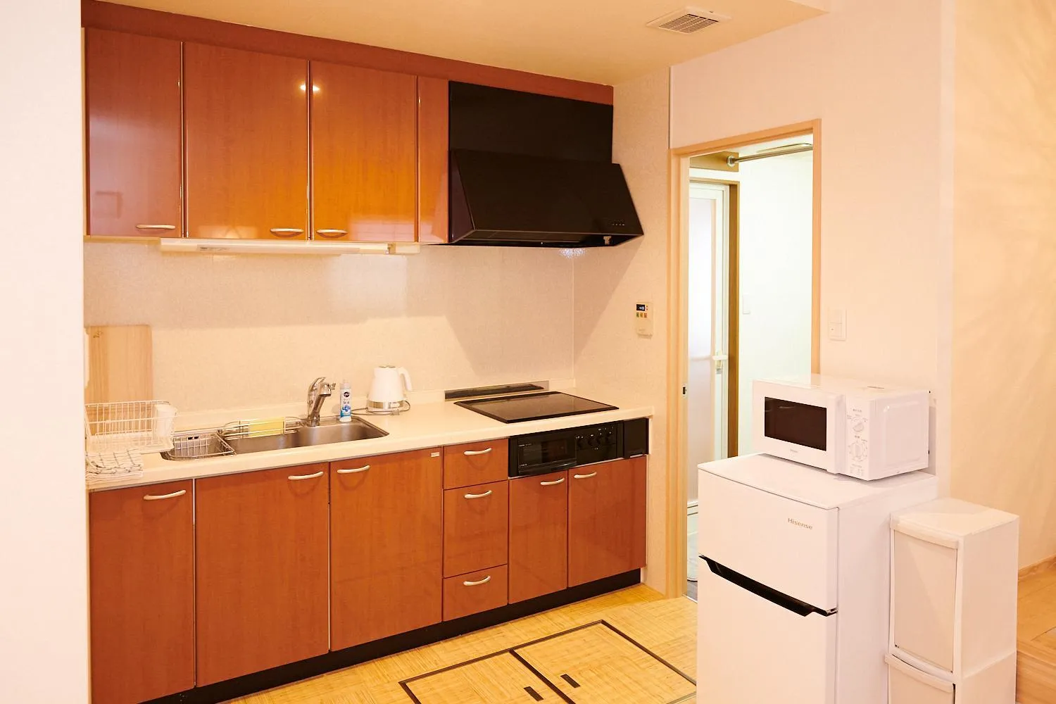 Kitchen or kitchenette in Ueno Residence Hotel Matsumoto