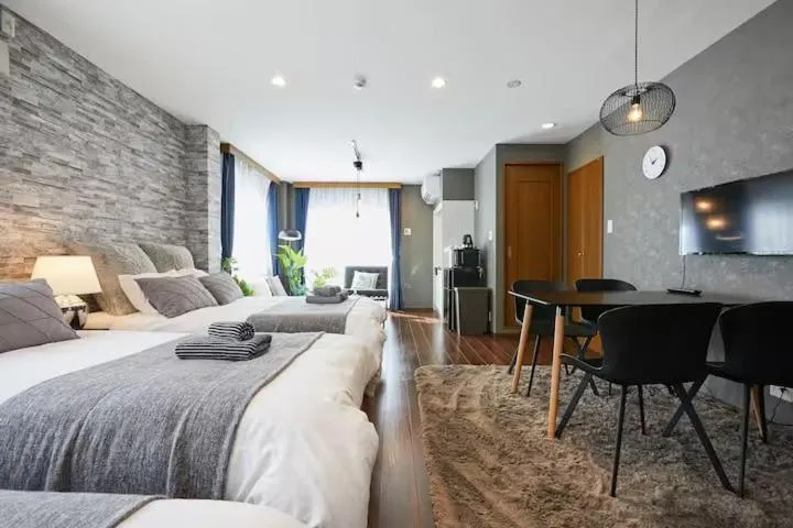 Living room, Bed in Ueno Residence Hotel Matsumoto