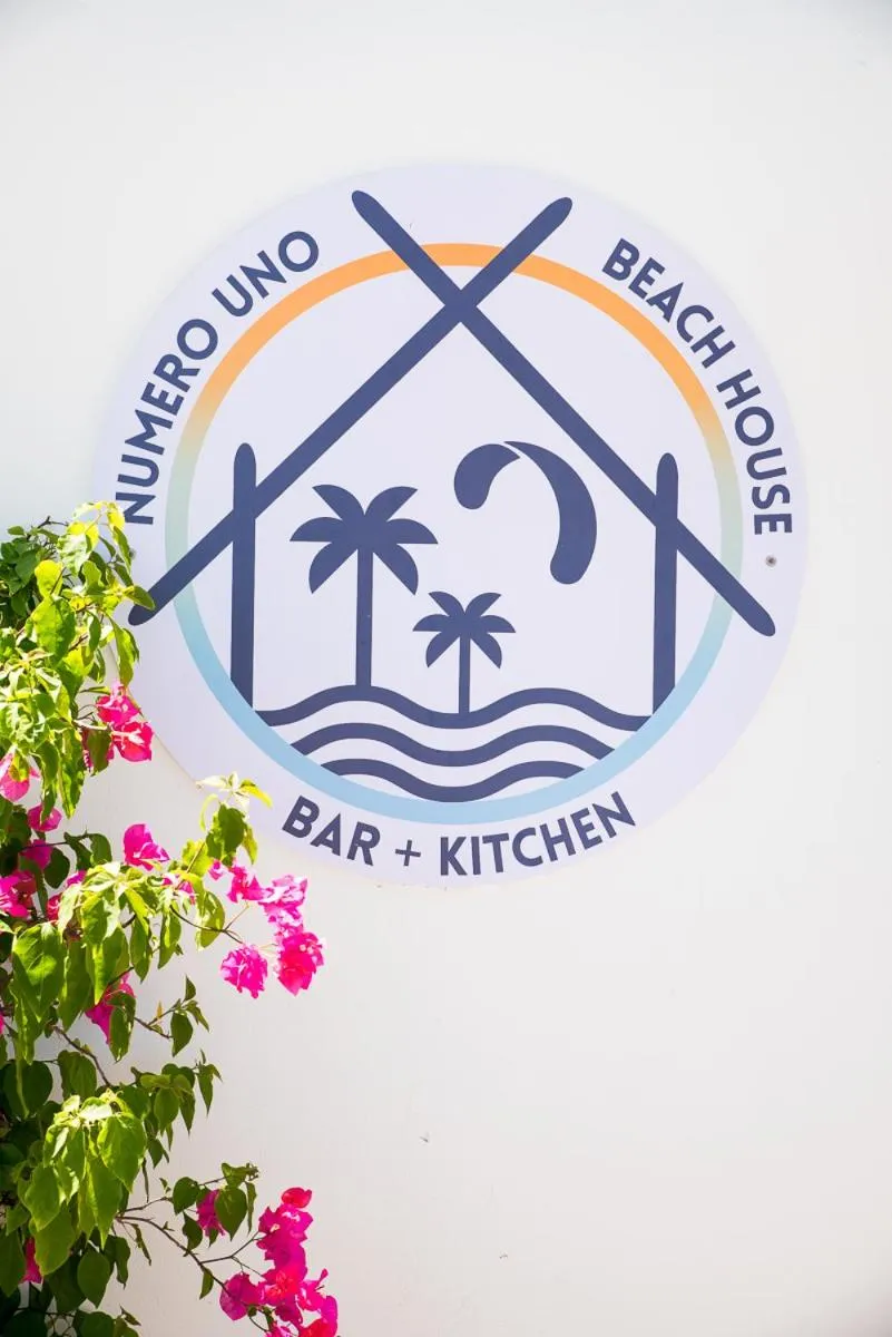 Property logo or sign in Numero Uno Beach House